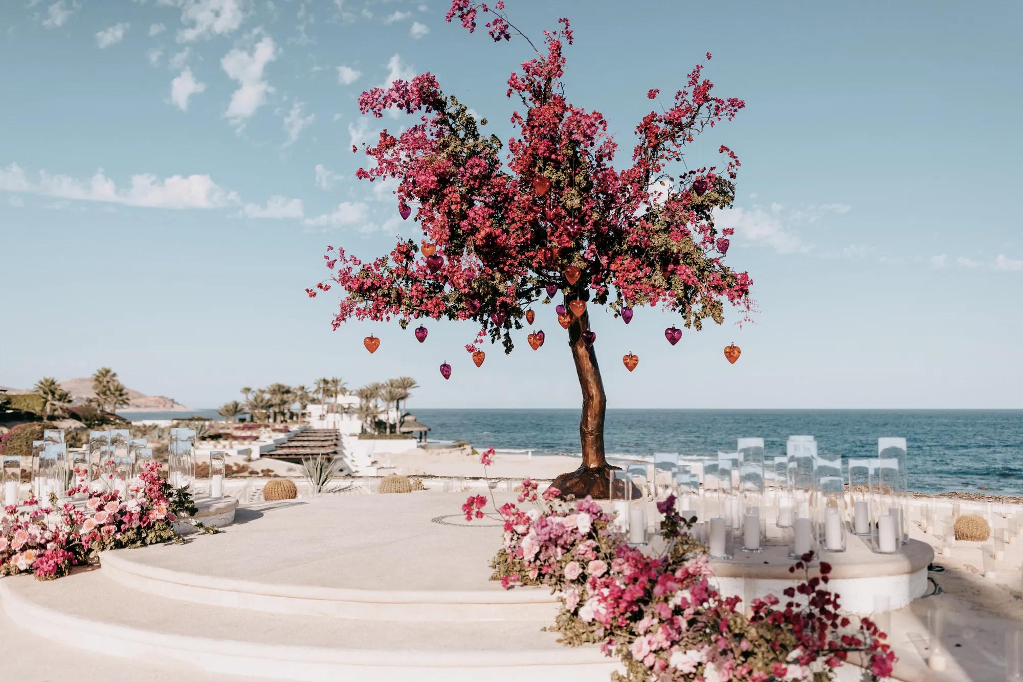 Lantern-lit sculpted trees at Arbol
