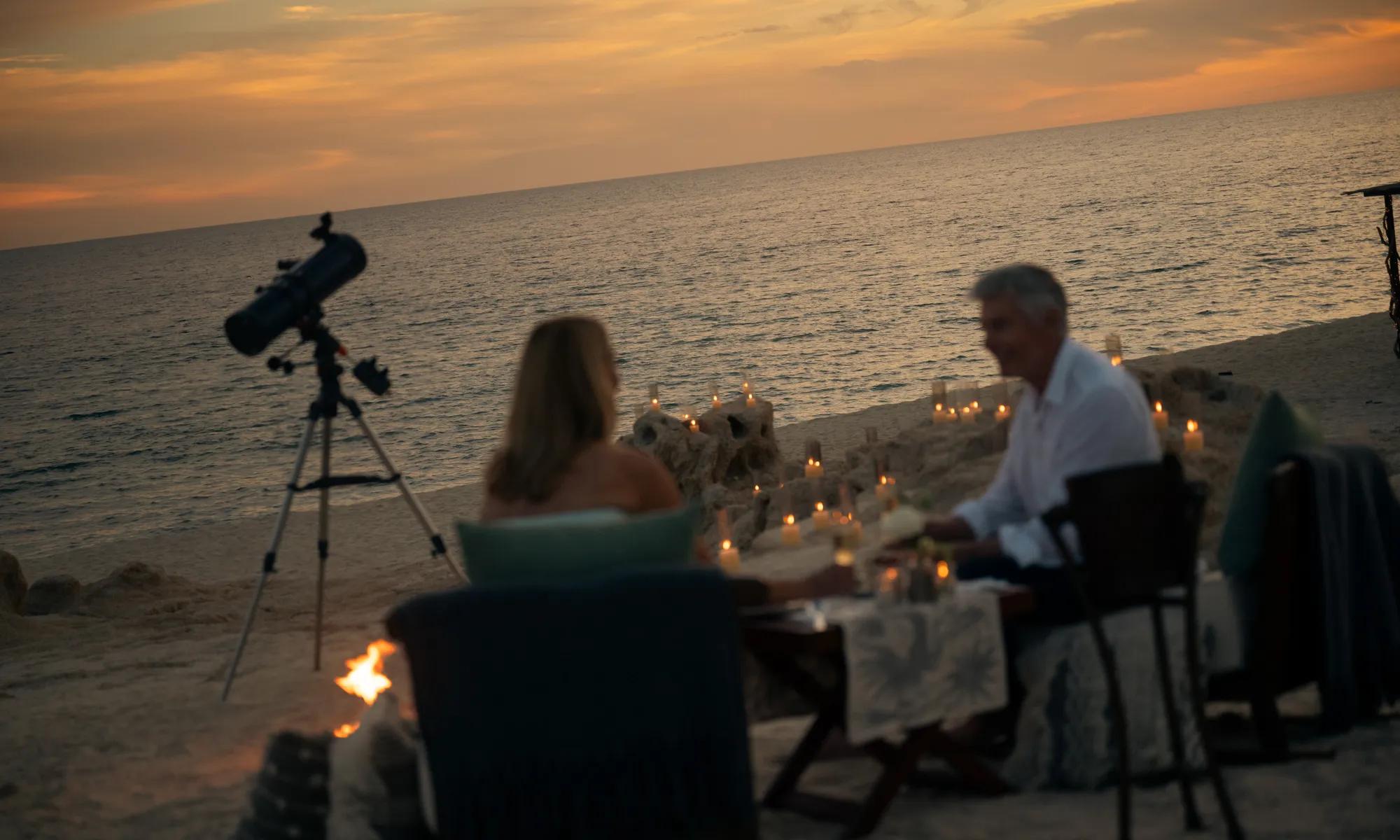 beachfront dinning with sunset and candles in the privacy of a luxurious villa