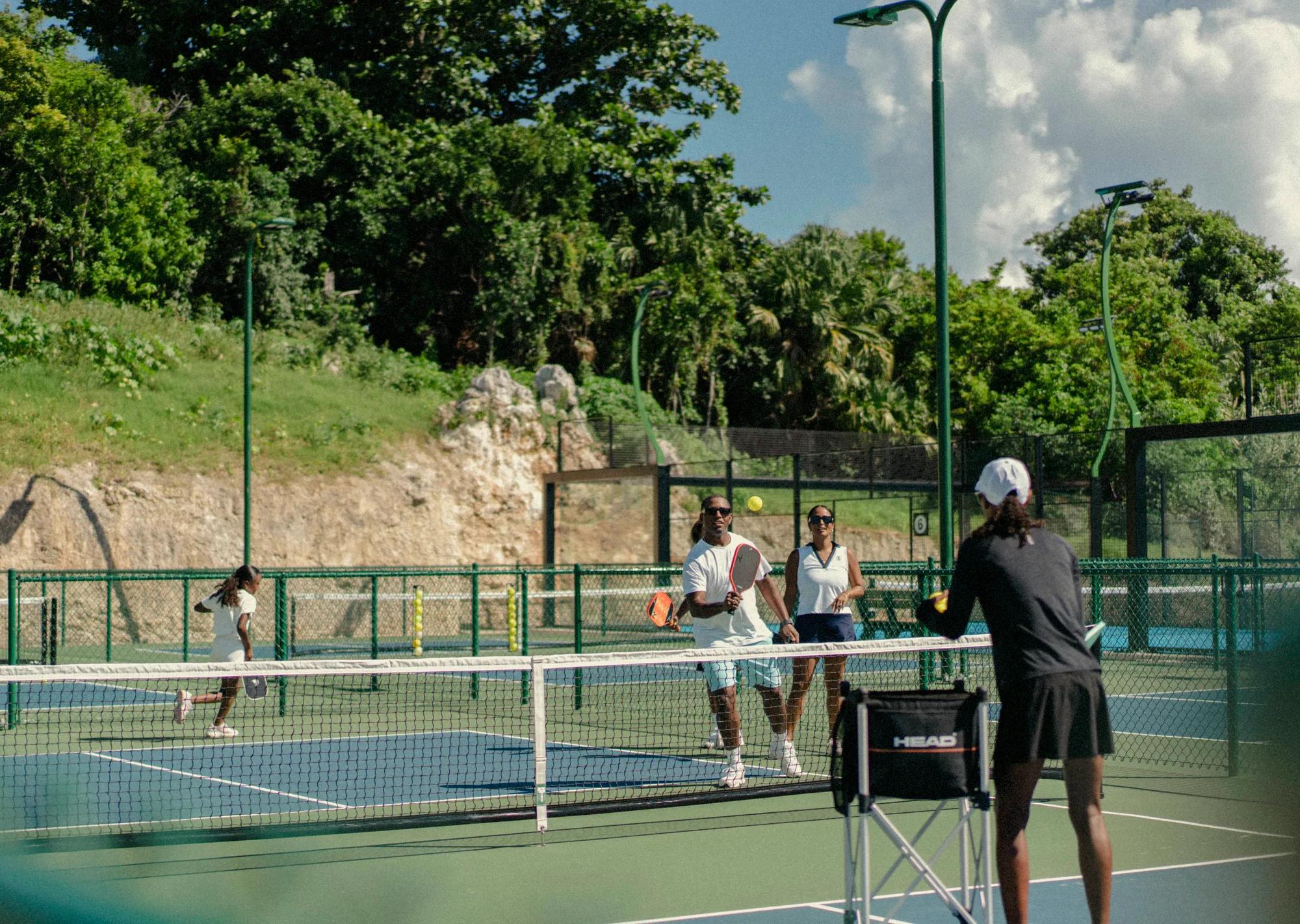 A family playing pickleball