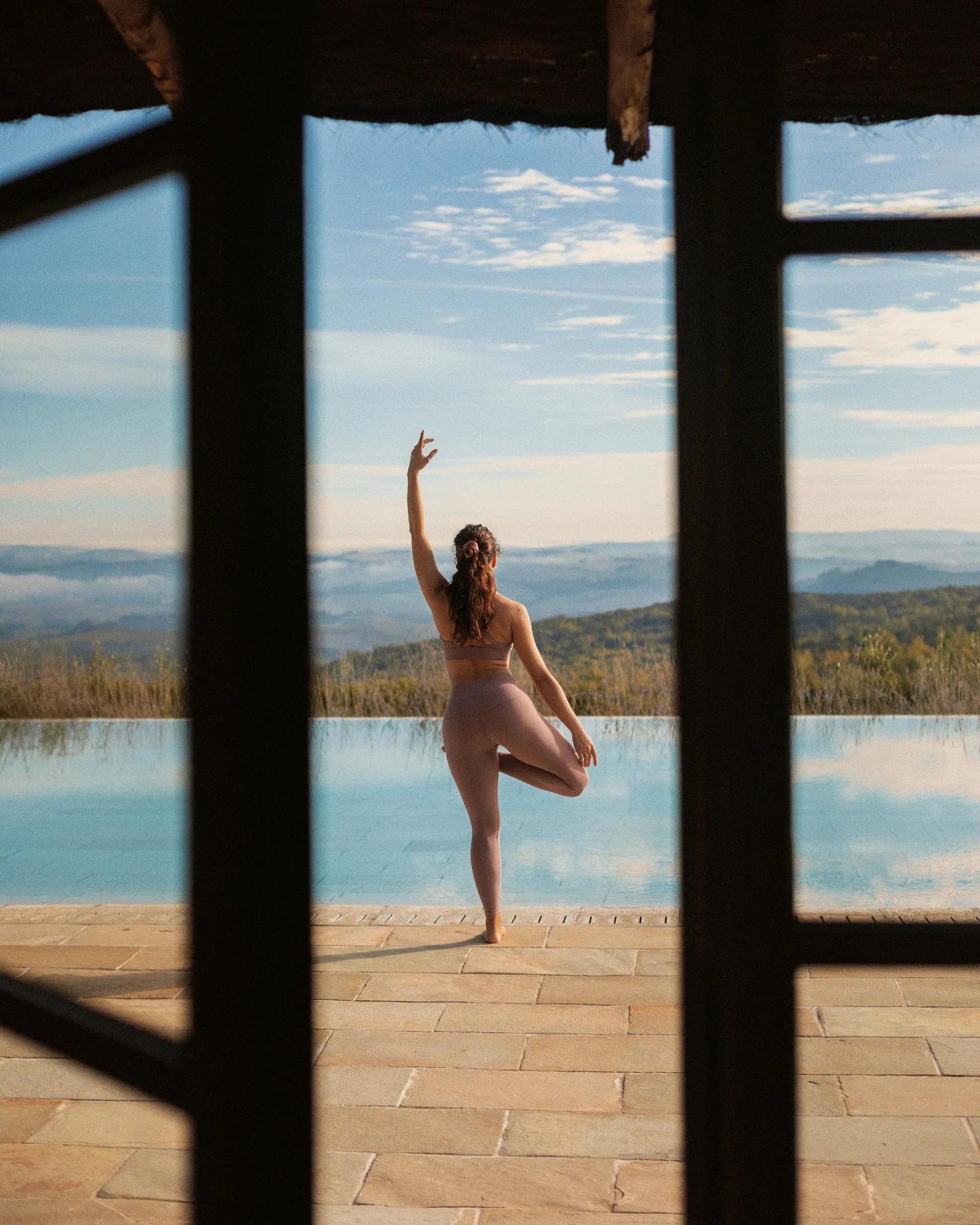 Yoga lesson by the infinity pool.