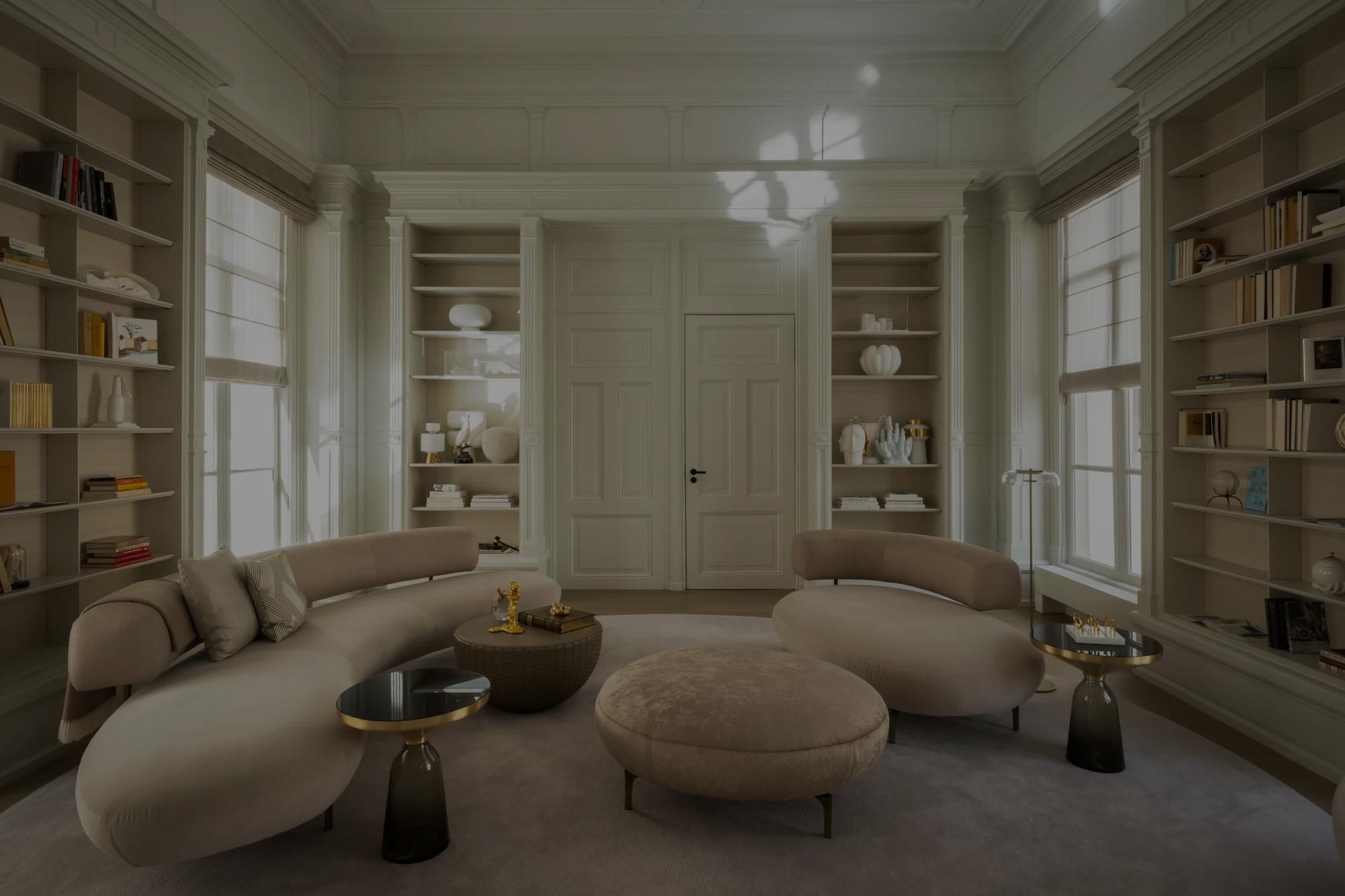 A luxury hotel suite in Amsterdam with a king-sized bed, a light-up headboard, a seating area, and large windows showing the city.