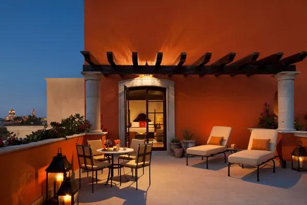 Rooftop Colonial Suite at Rosewood San Miguel de Allende with private terrace, city views, and open-air lounge at sunset.