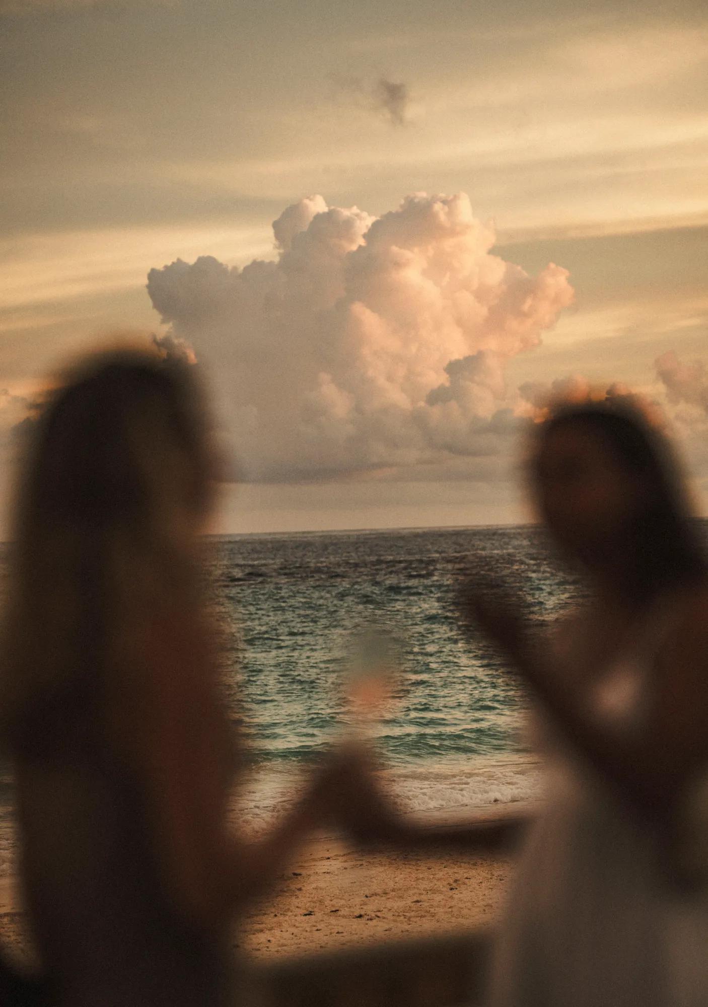 Two girls cheersing with a glass of champagne
