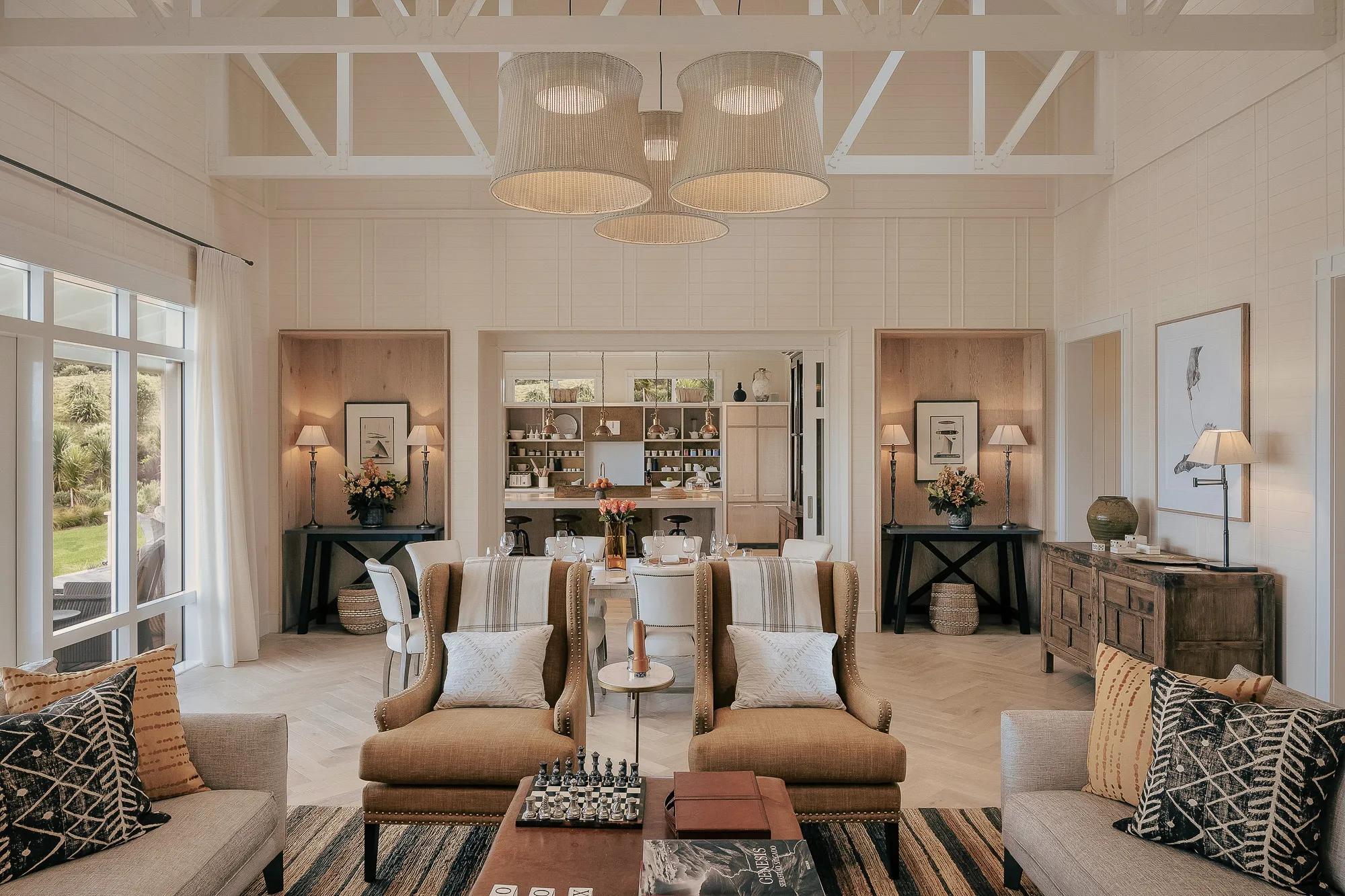 Open plan kitchen, dining and living area in a luxury villa with contemporary interiors.