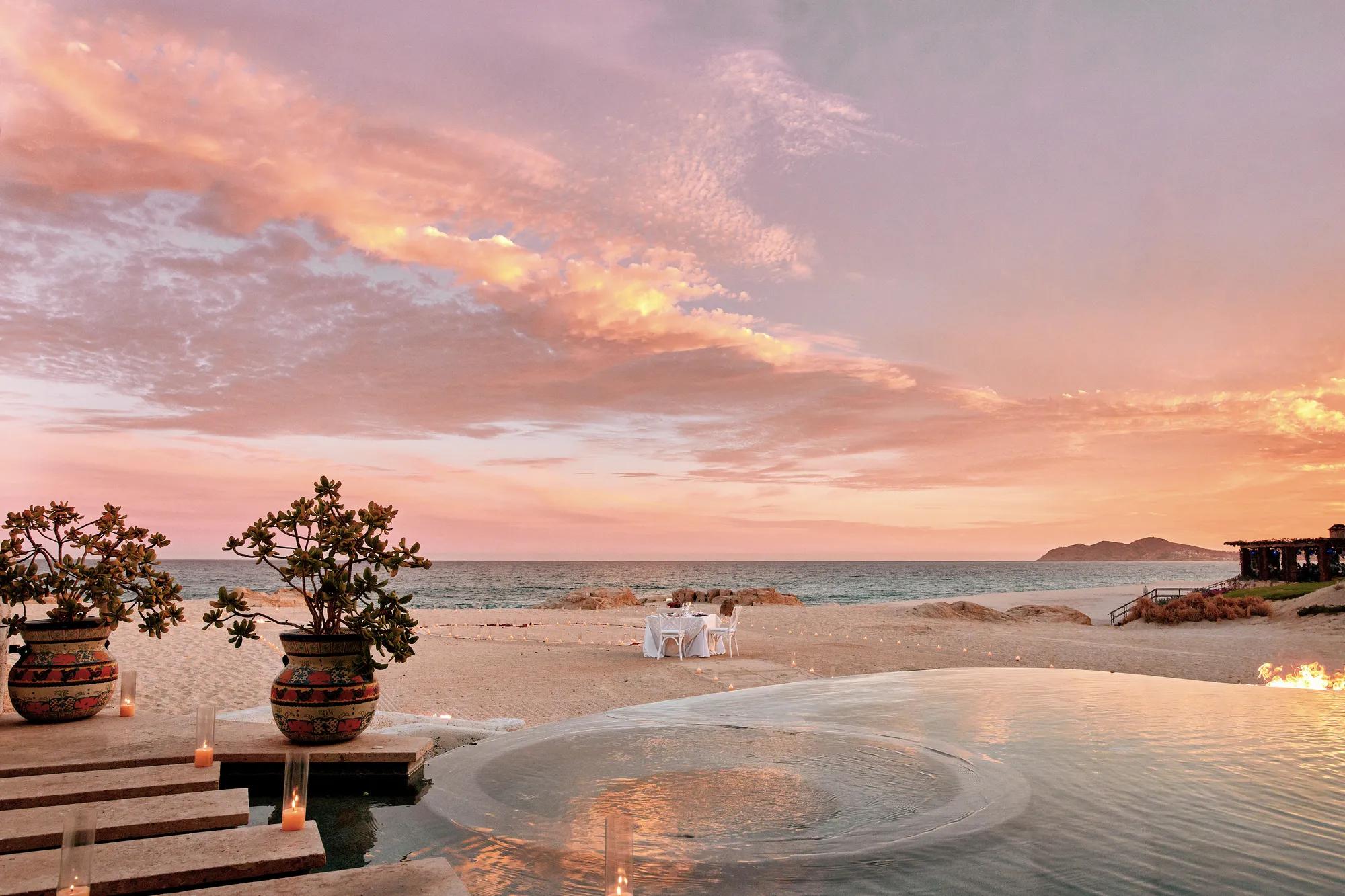 beachfront dinning with sunset and candles in the privacy of a luxurious villa