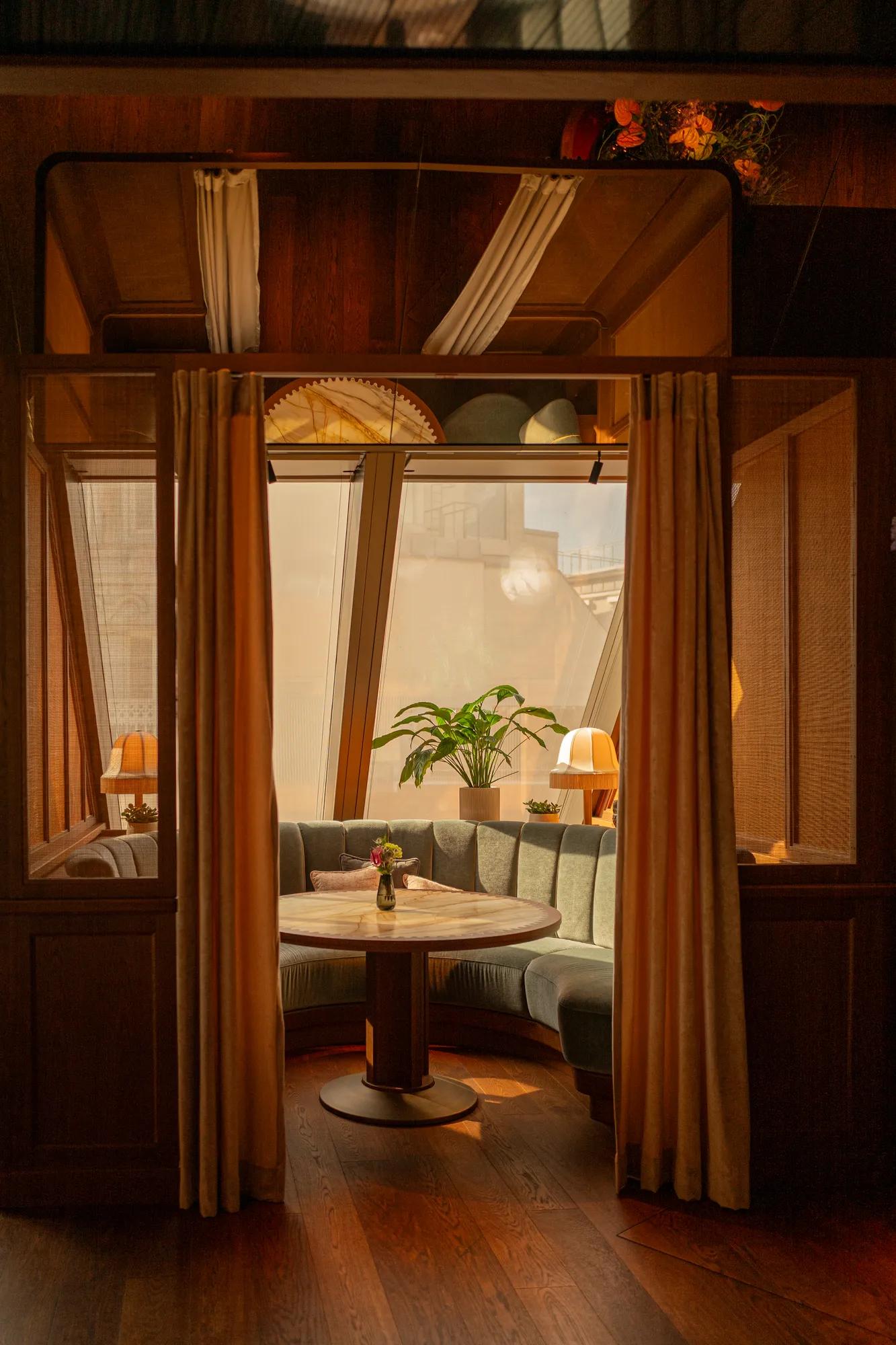 Sitting niche at Neue Hoheit Bar with a view over Vienna's Rooftops