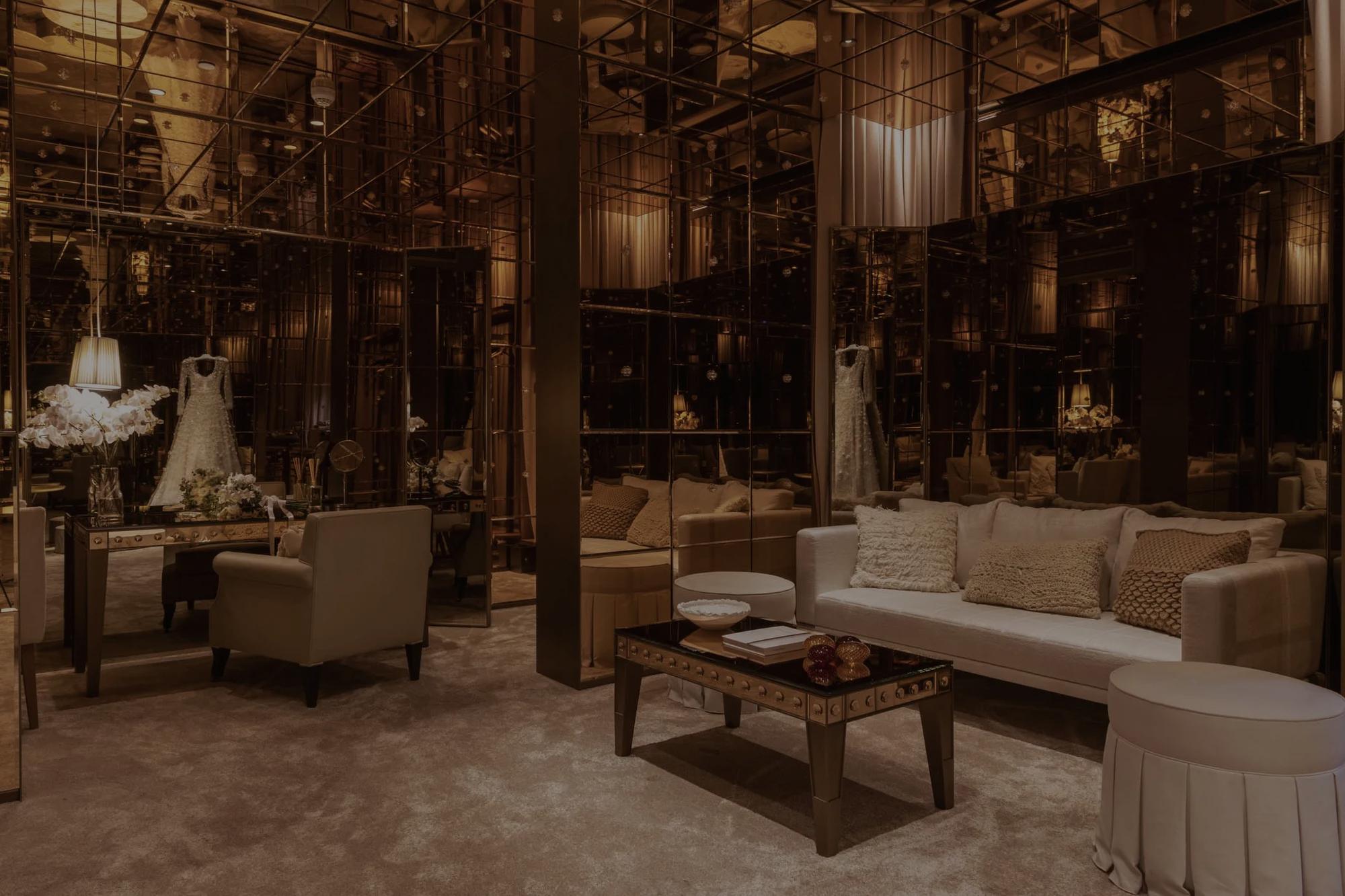 Bride's room with wedding dress and mirrored walls.