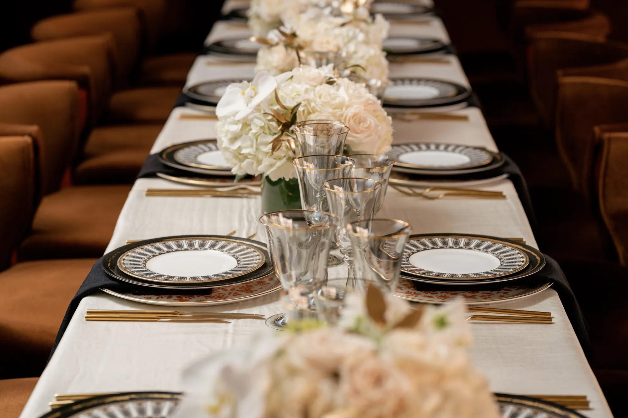 Private event table setting with brown chairs and an ivory linen at Rosewood Washington D.C. in the heart of Georgetown.