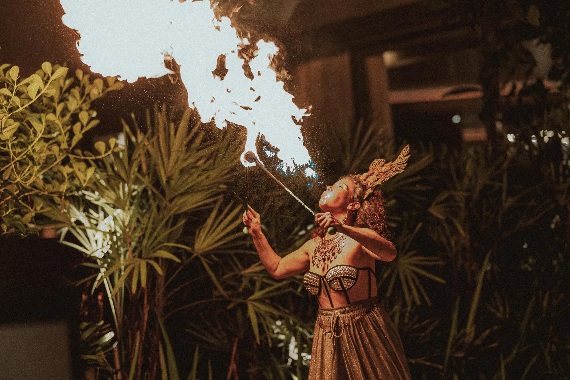 An image of a fire performer presenting their art at Rosewood São Paulo.
