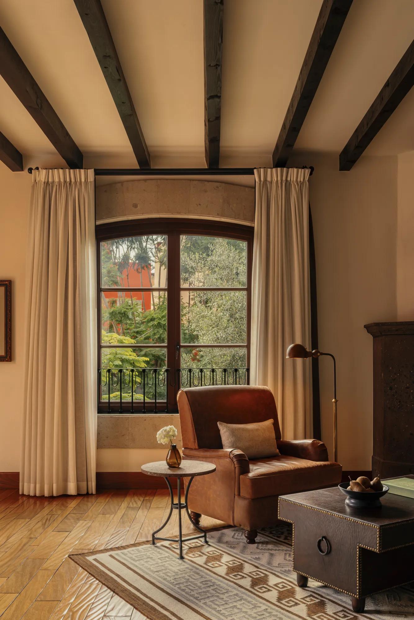 Junior Suite at Rosewood San Miguel de Allende with king bed, private terrace, sitting area, and garden views.