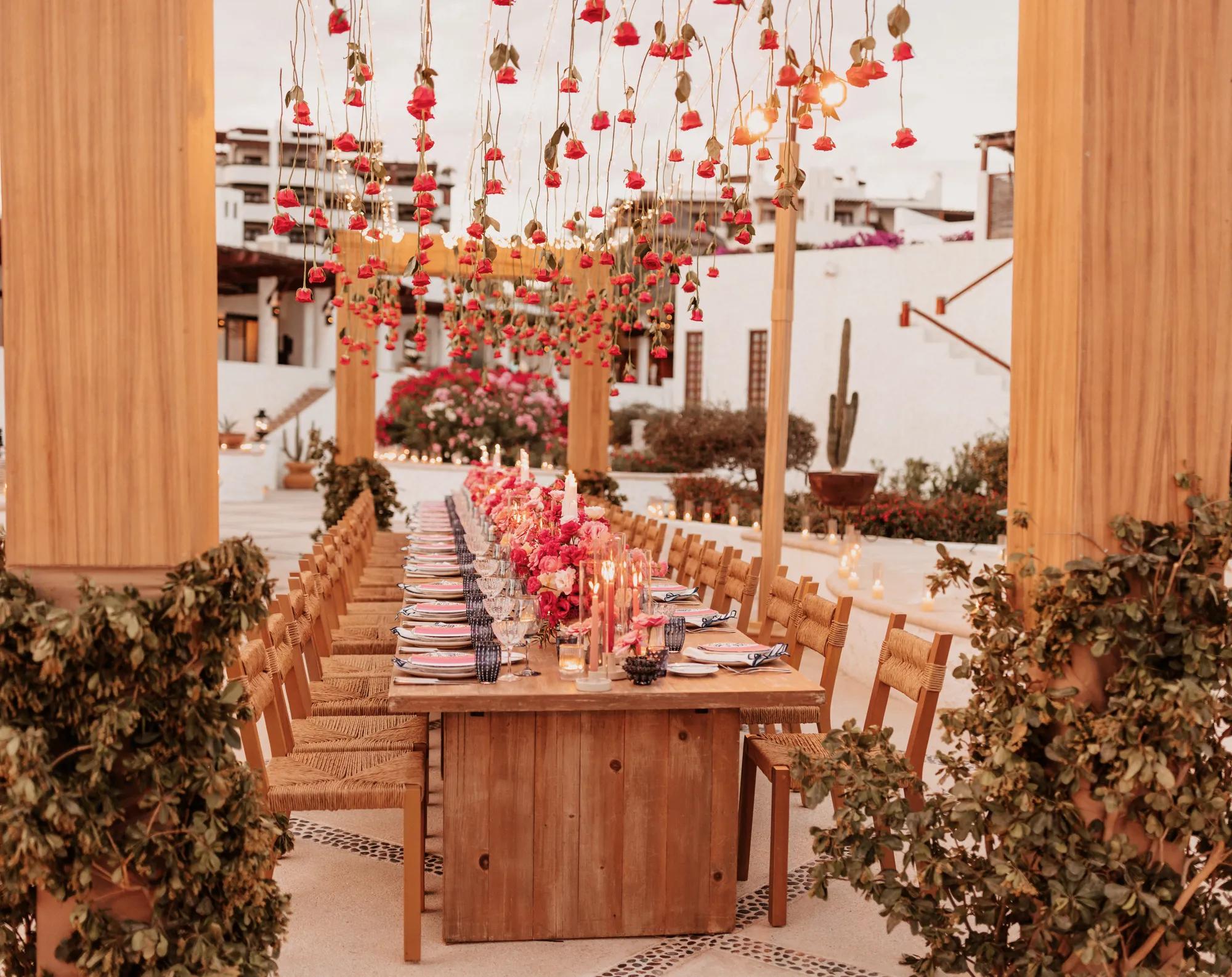 outdoor private venue decorated with vibrand flowers and candles