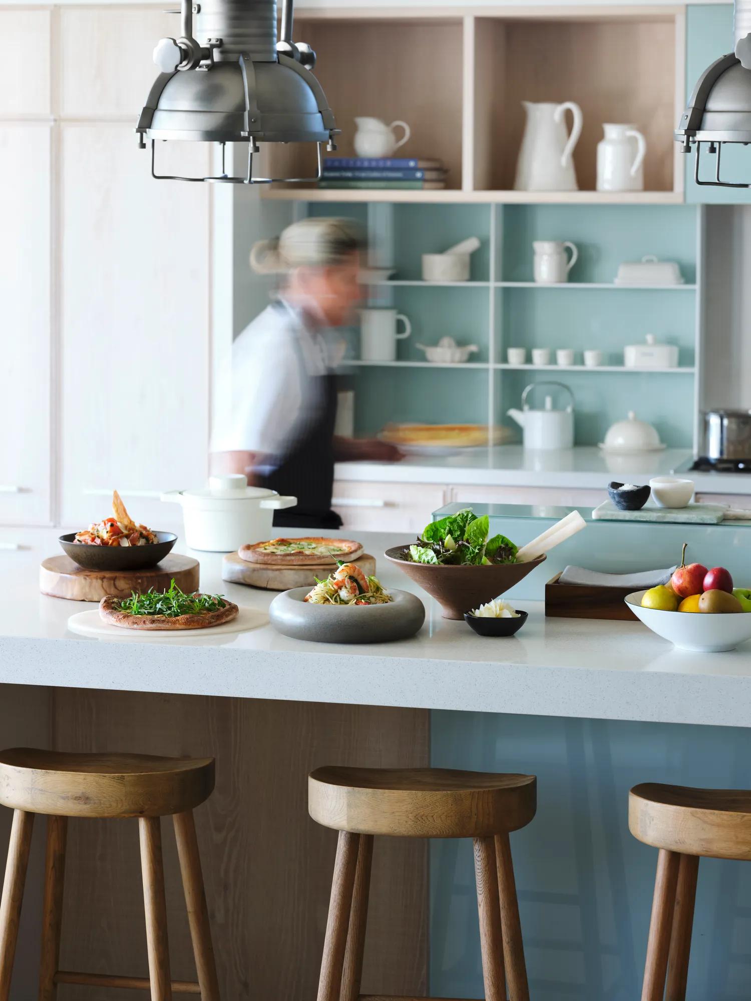 Private chef cooks a Italian feast in a contemporary kitchen in a private villa 