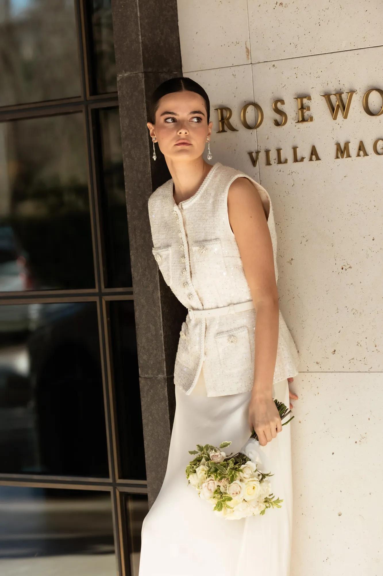 Young bride standing outside Rosewood Villa Magna in Madrid