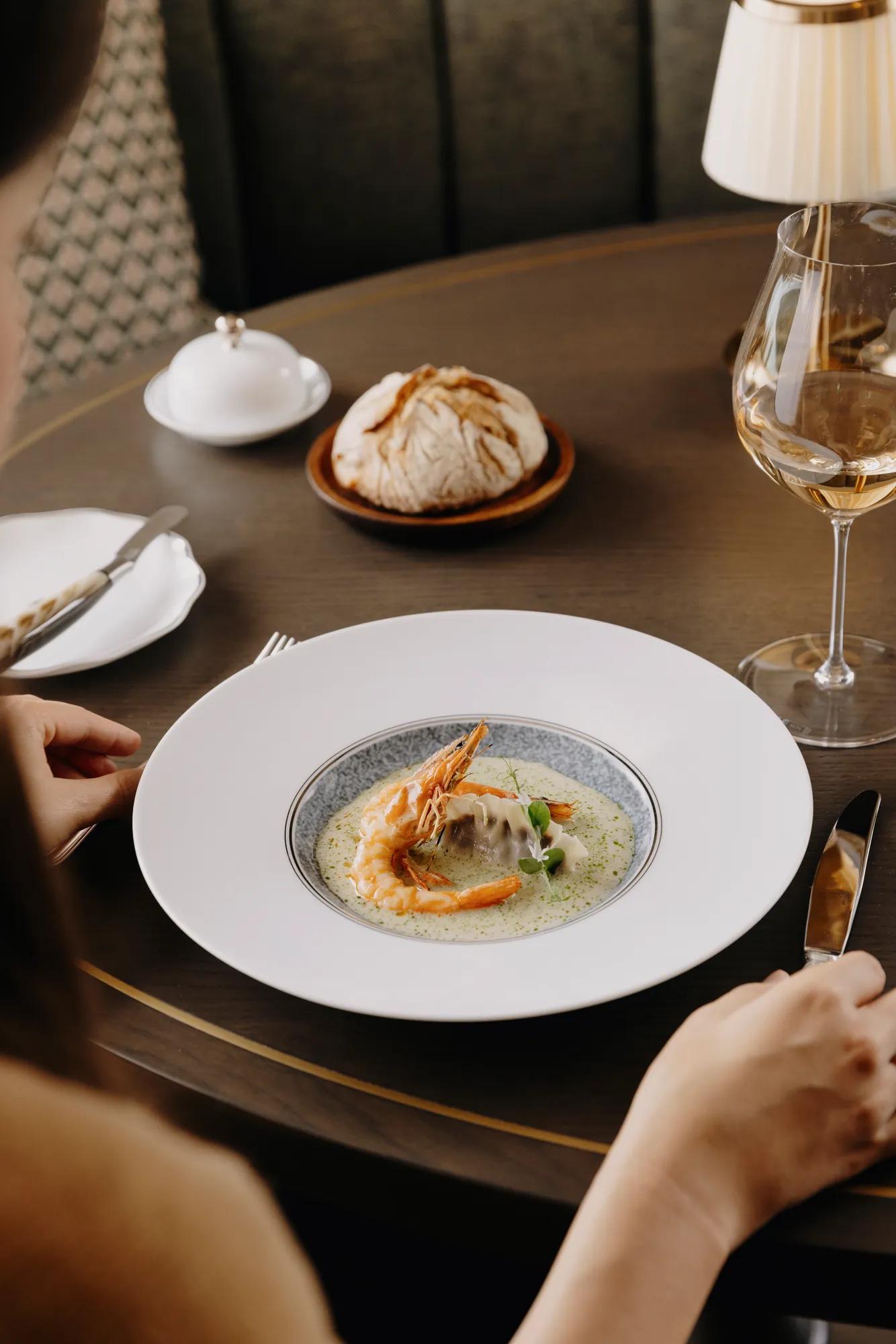 Dish showcasing a dumpling and styrian alpine prawn 