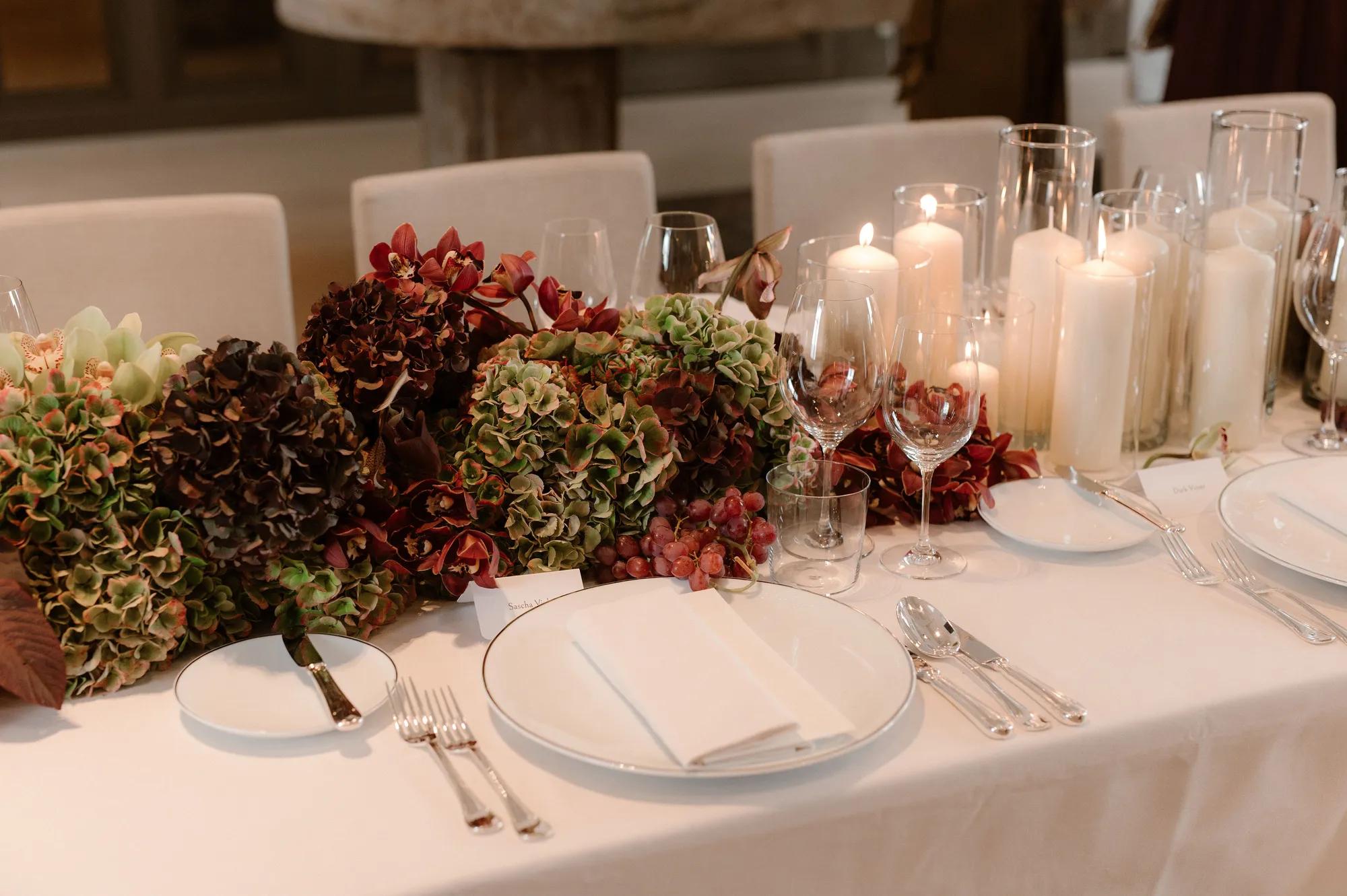 Celebration table decorated with candles and flowers