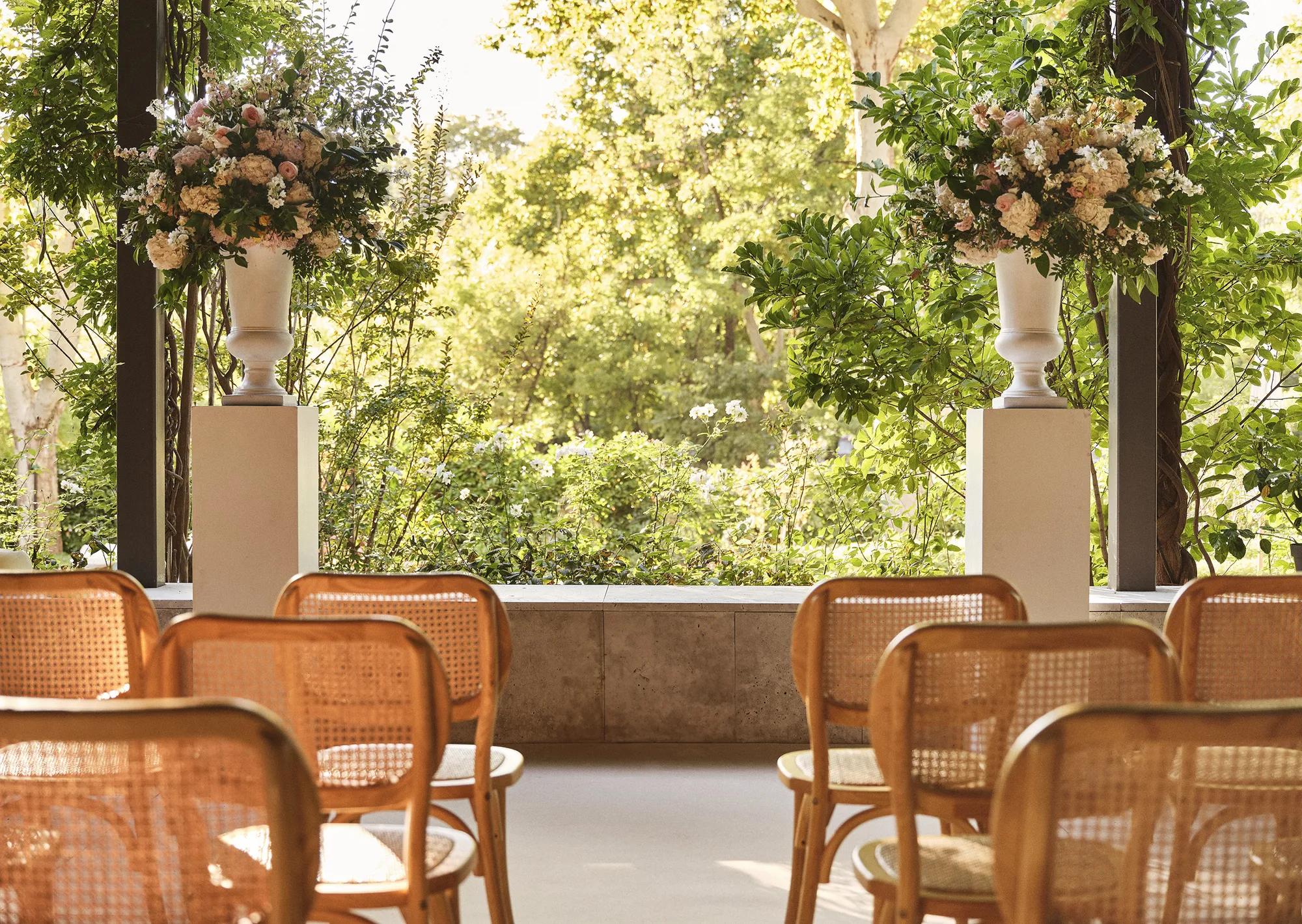 Wedding ceremony setup on the garden terrace at Rosewood Villa Magna in Madrid