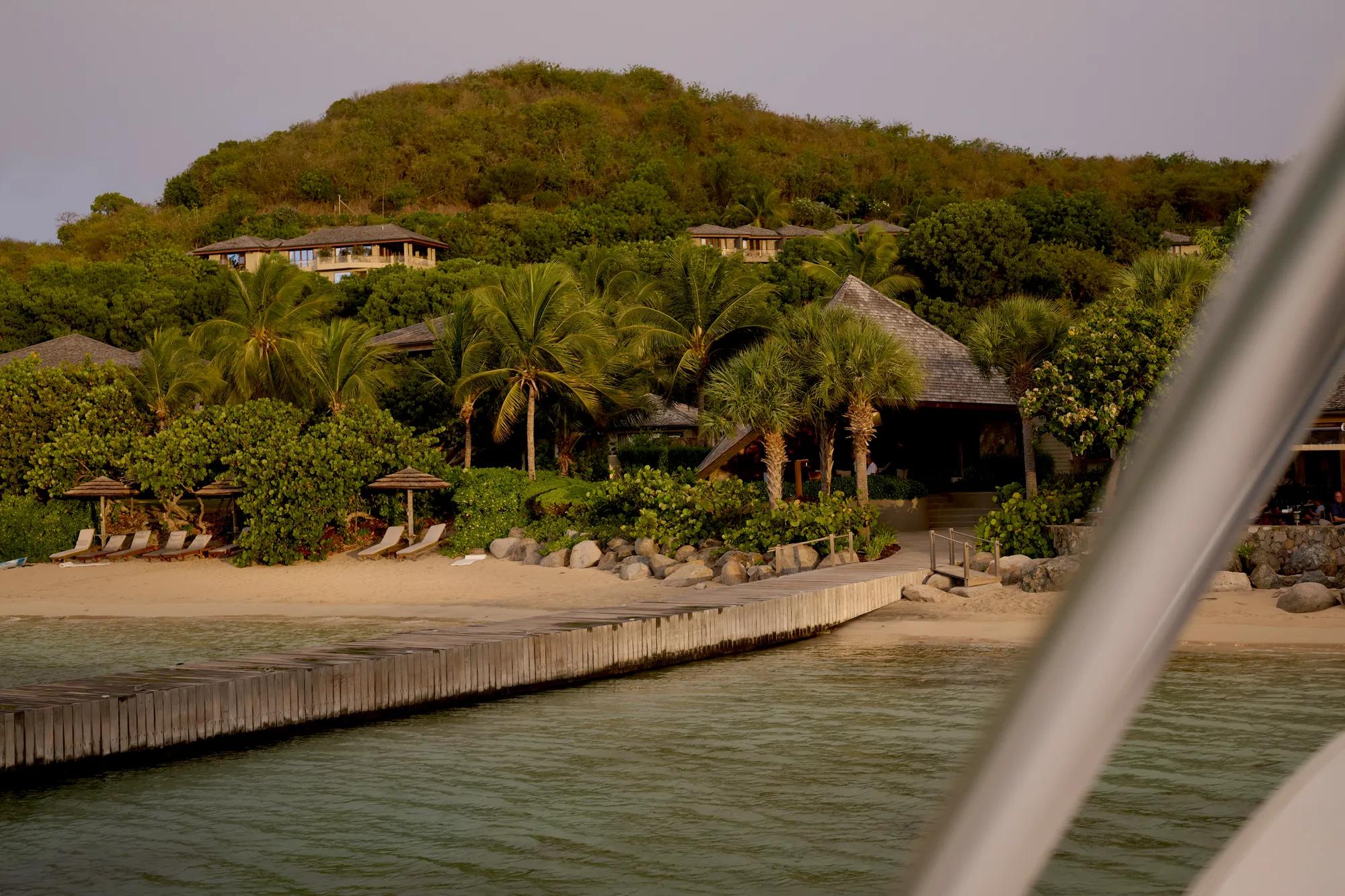 A view from a boat pulling into Little Dix Bay