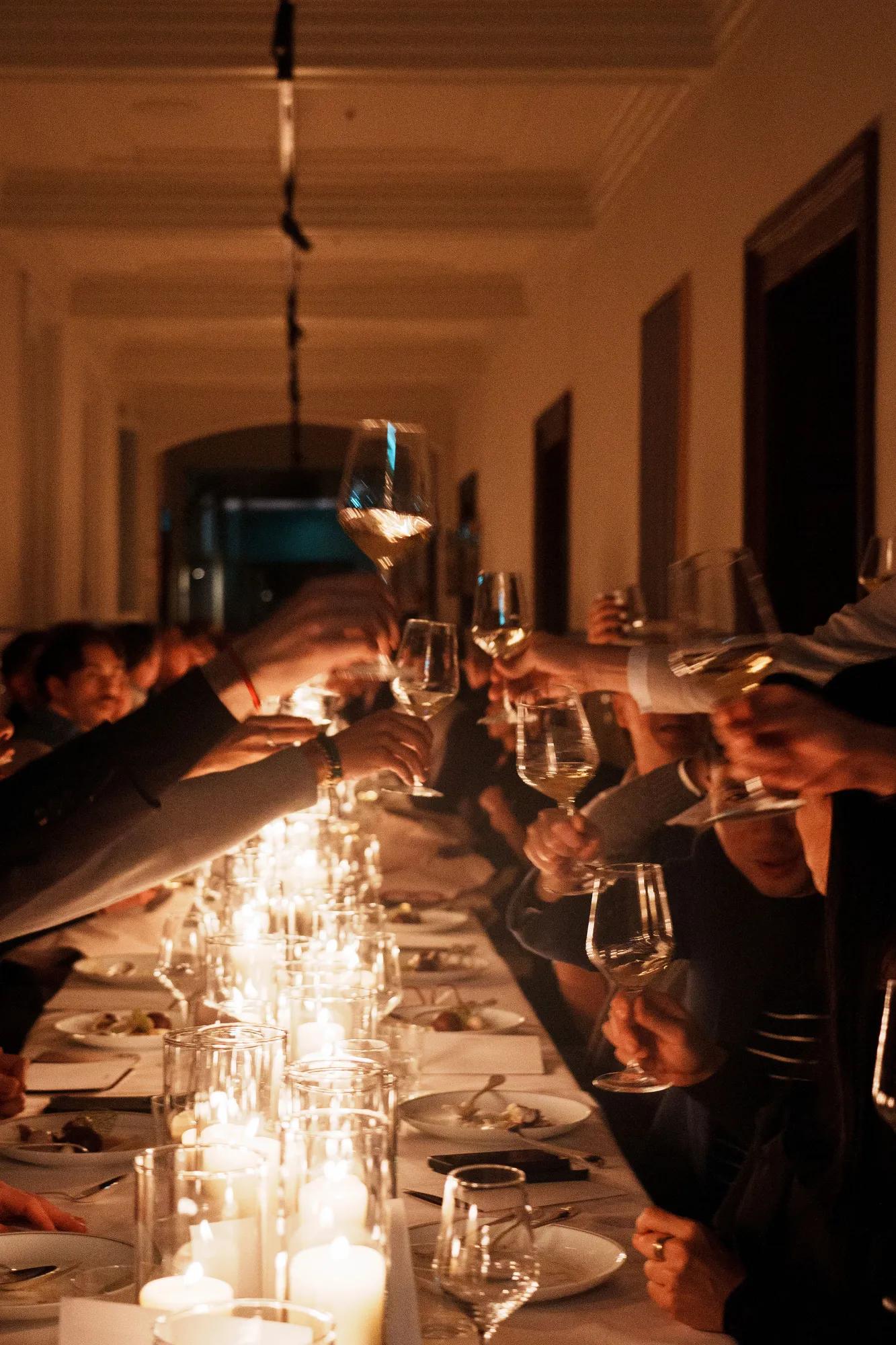 Cheering croud with toasting glasses