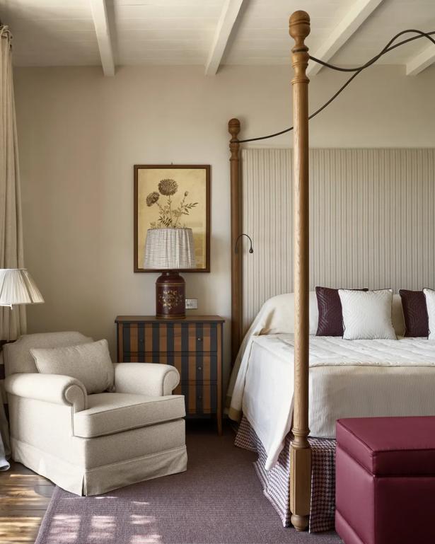 Spacious suite in Tuscany with exposed beam ceiling and French doors.