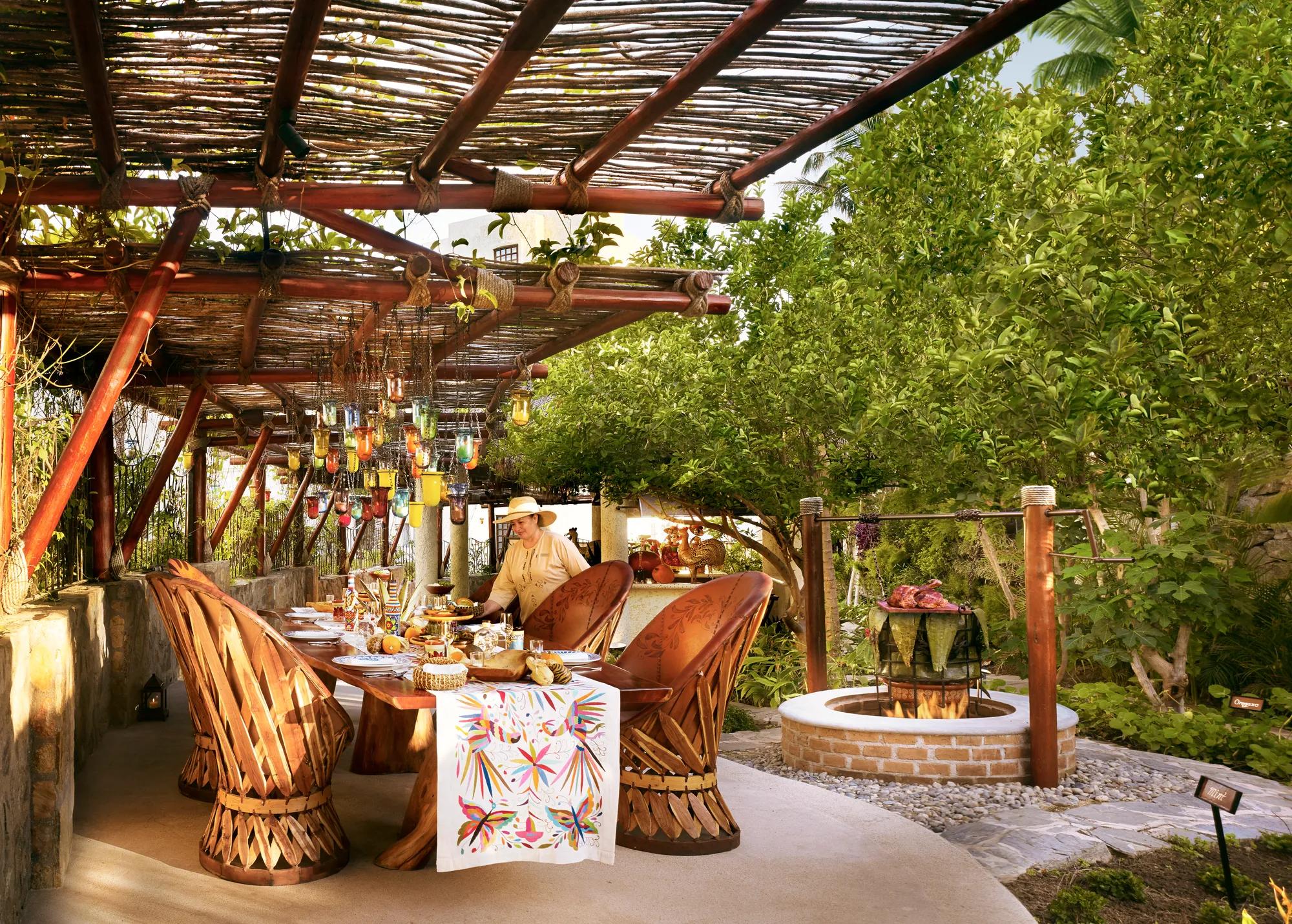 Table set in garden area next to fire pit