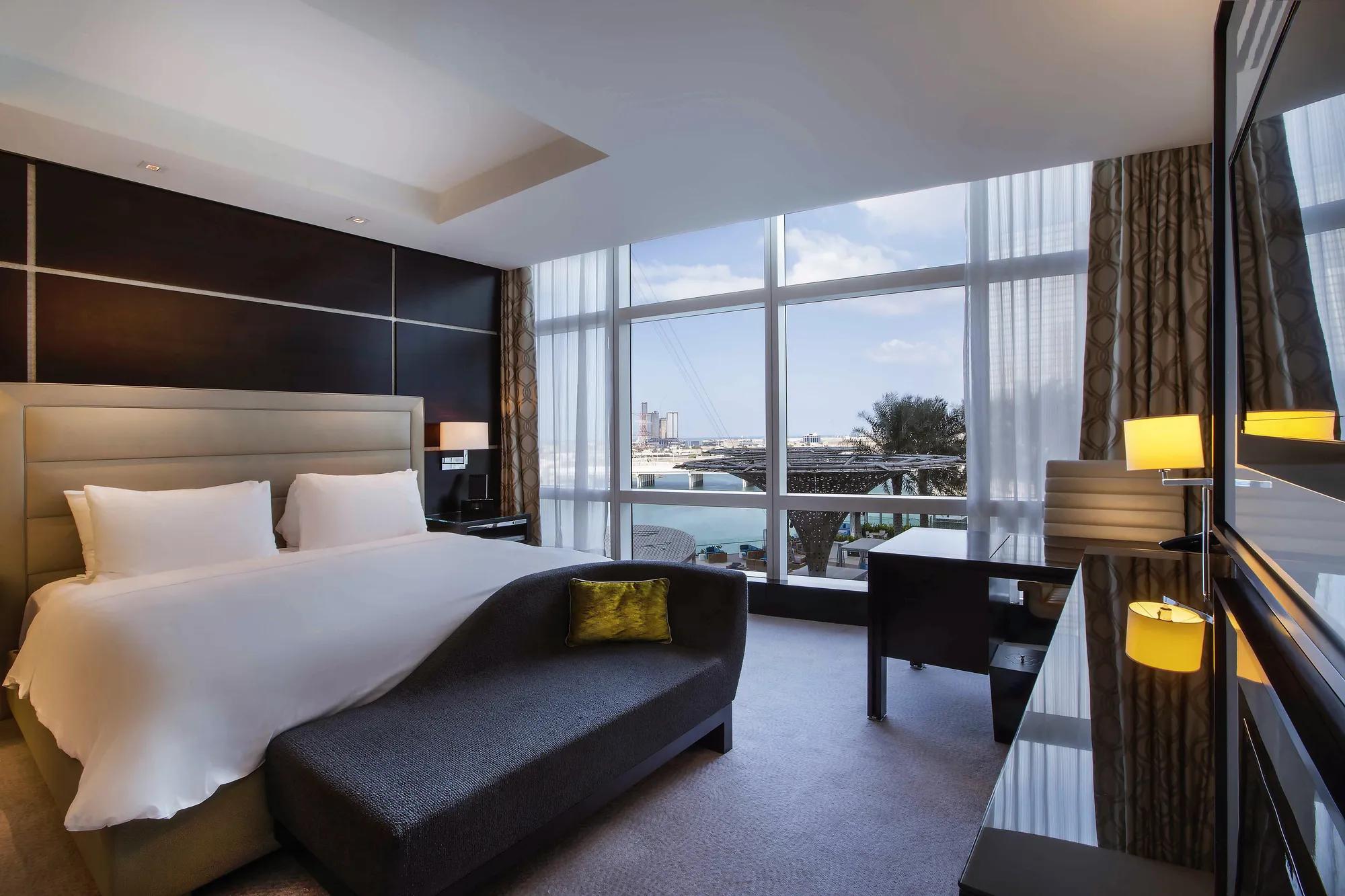 Our spacious Deluxe Rooms are styled for contemporary comfort and decorated with subtle tones of dark wood offset by contrasting fabrics.