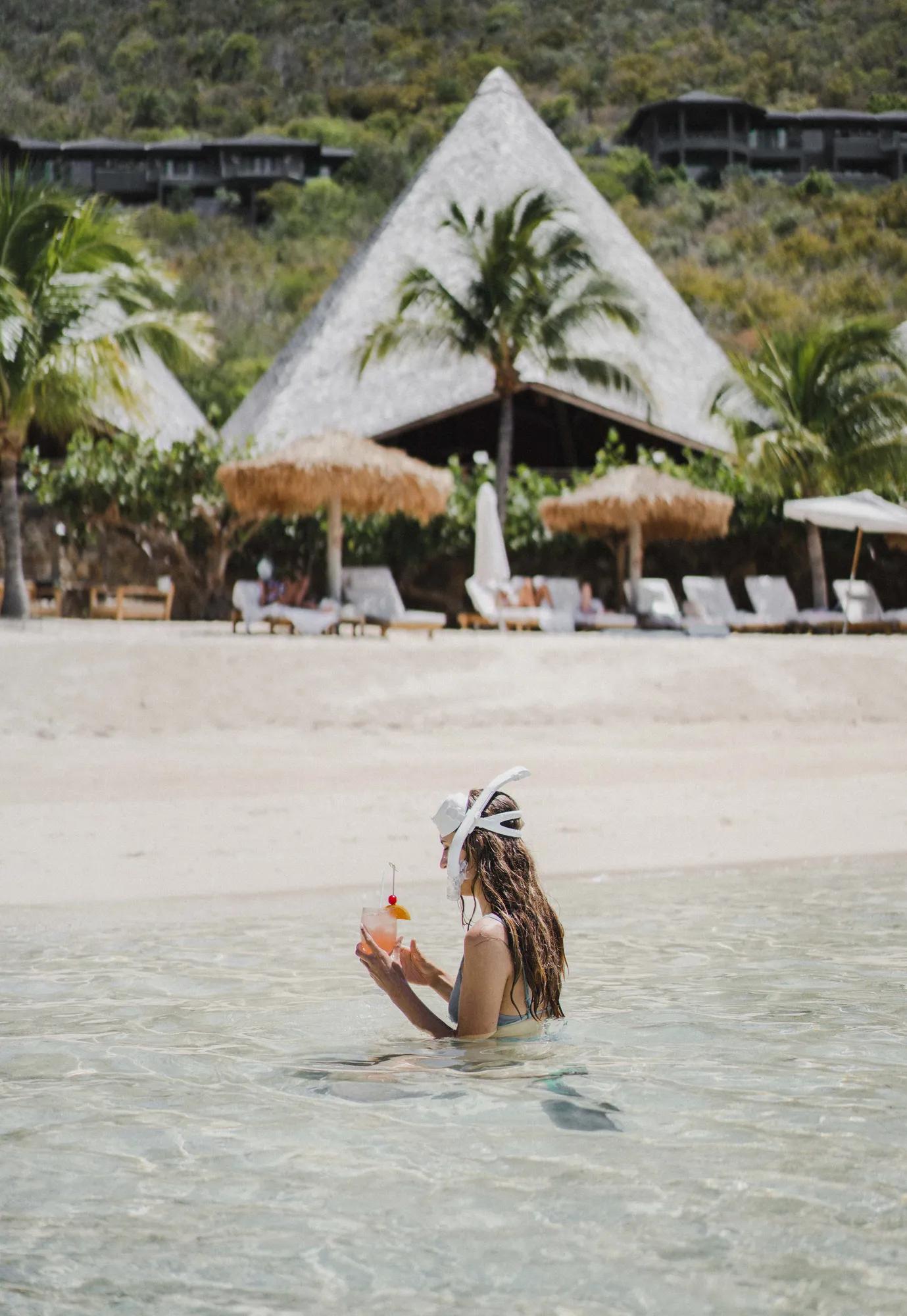 Drinking a cocktail on the beach
