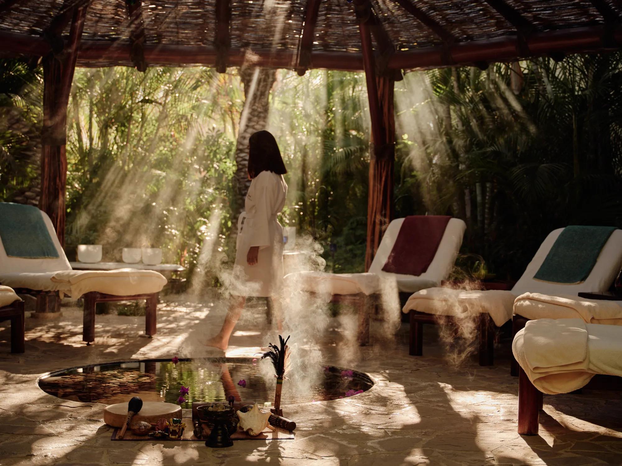 a women entering the spa at las ventanas surrounded by nature in a peaceful environment