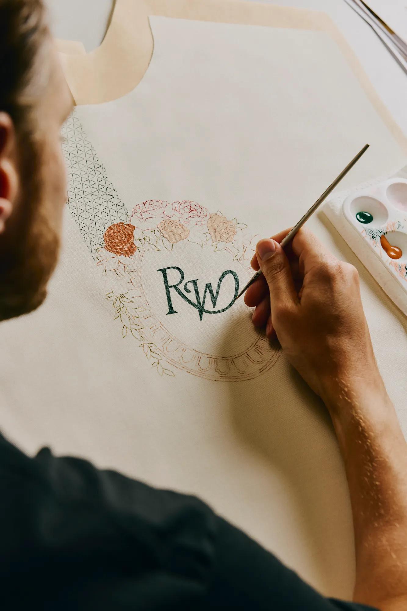 In the studio with Christian Jeffery painting logo