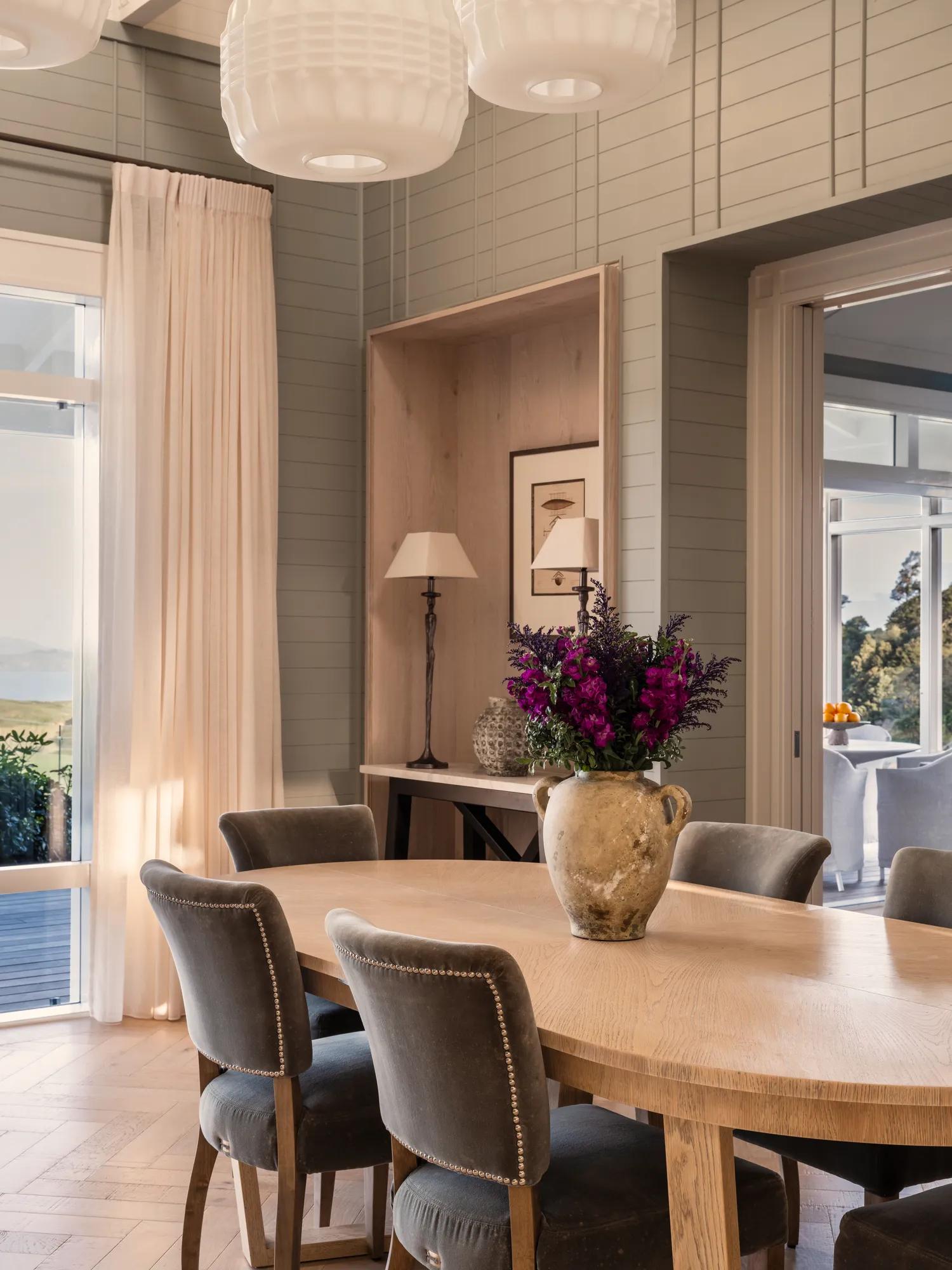 Open plan dining room in a luxurious four bedroom villa at Rosewood Kauri Cliffs with contemporary interiors.