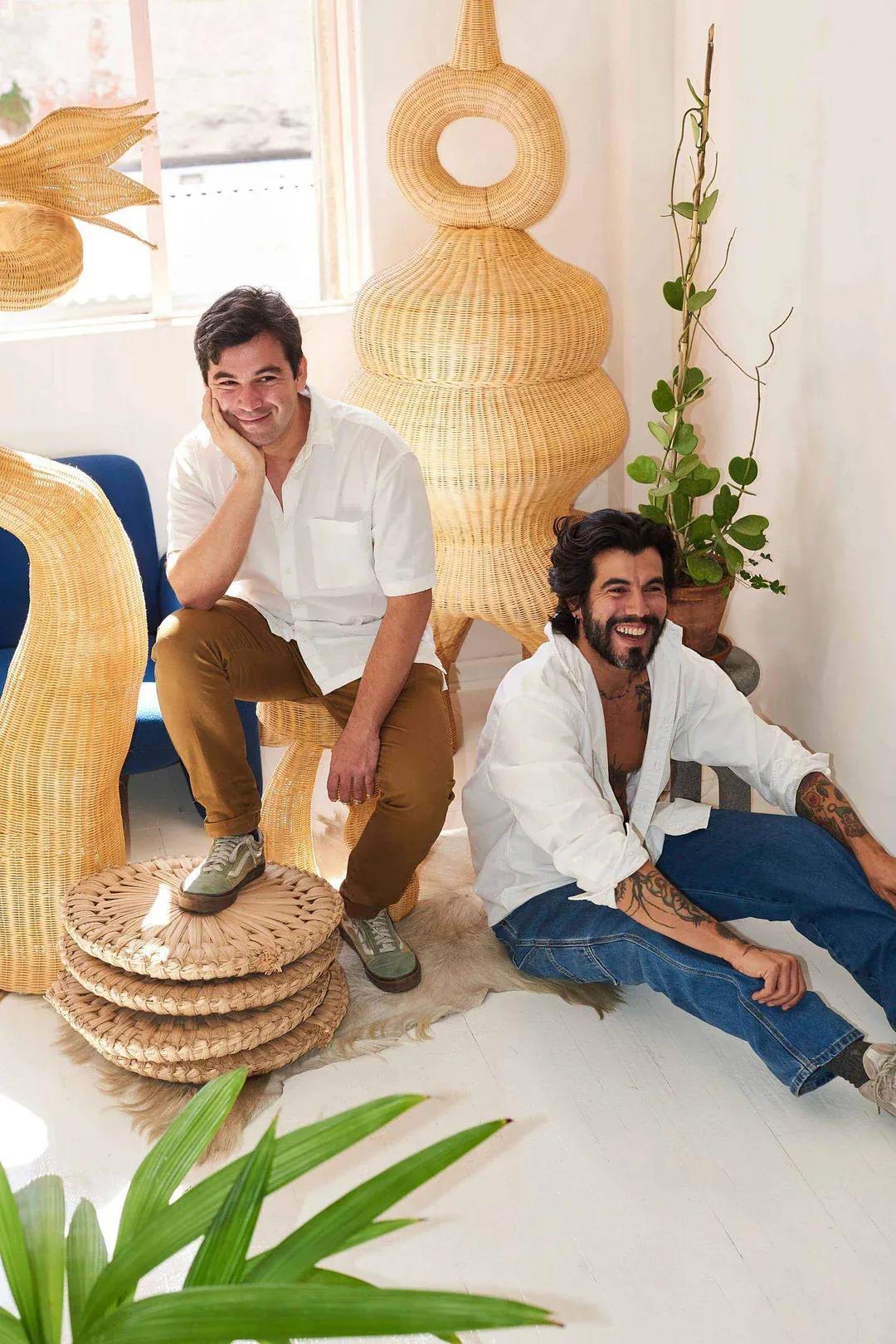 Artists from LØRDAG & SØNDAG seated in a light-filled studio surrounded by woven sculptures and natural materials, reflecting contemporary design rooted in traditional craftsmanship.