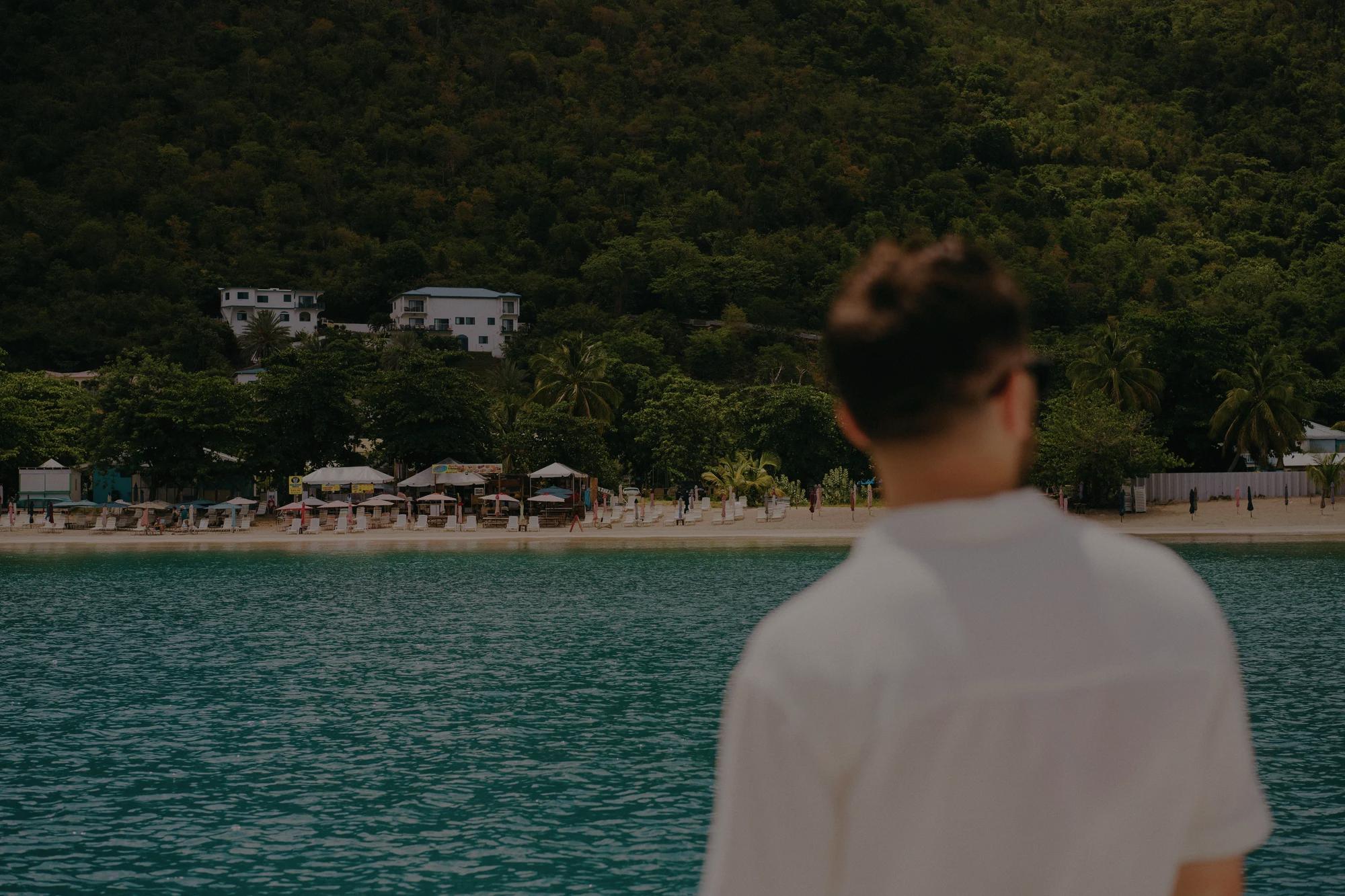 Man on boat looking at shore