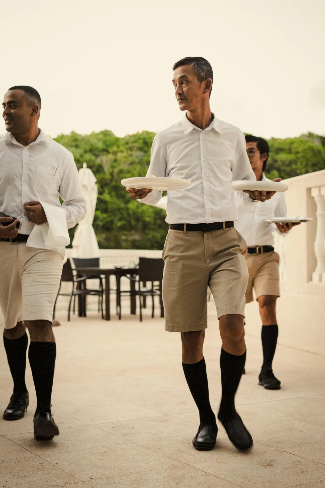 Waiters serving the six course dinner
