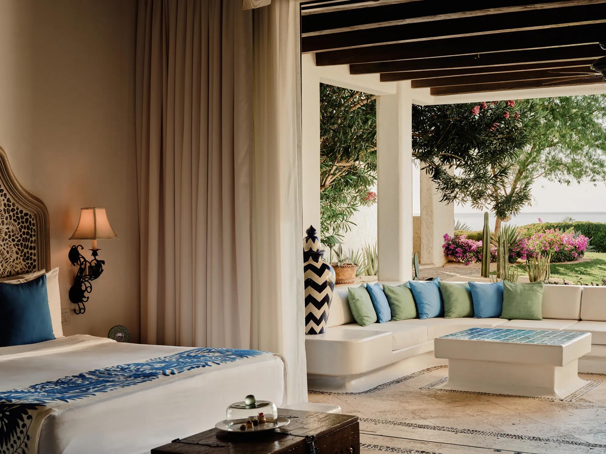 Las Ventanas al Paraíso - Room opening onto a garden terrace with cacti and bougainvillea