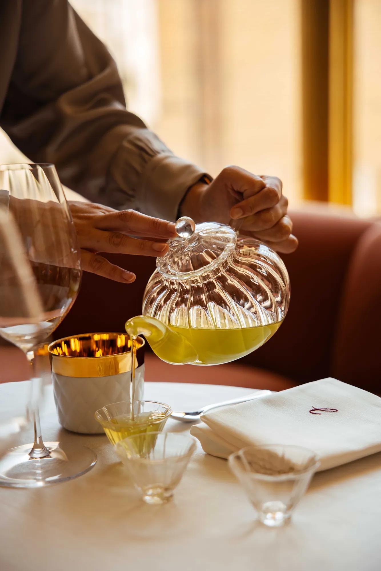 tea pured from glass teapot in Jacqueline