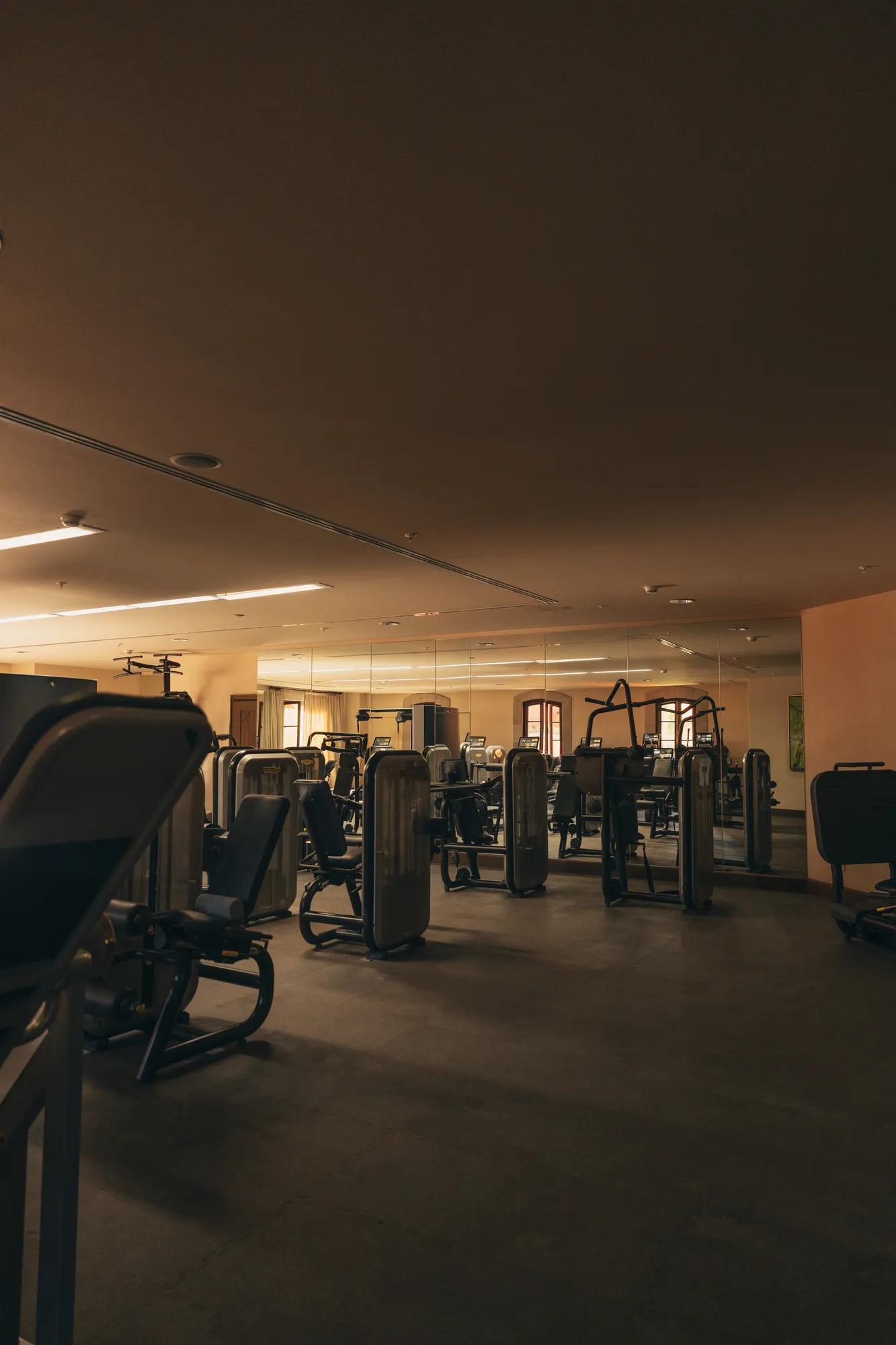 Fully equipped fitness center with an open workout area.