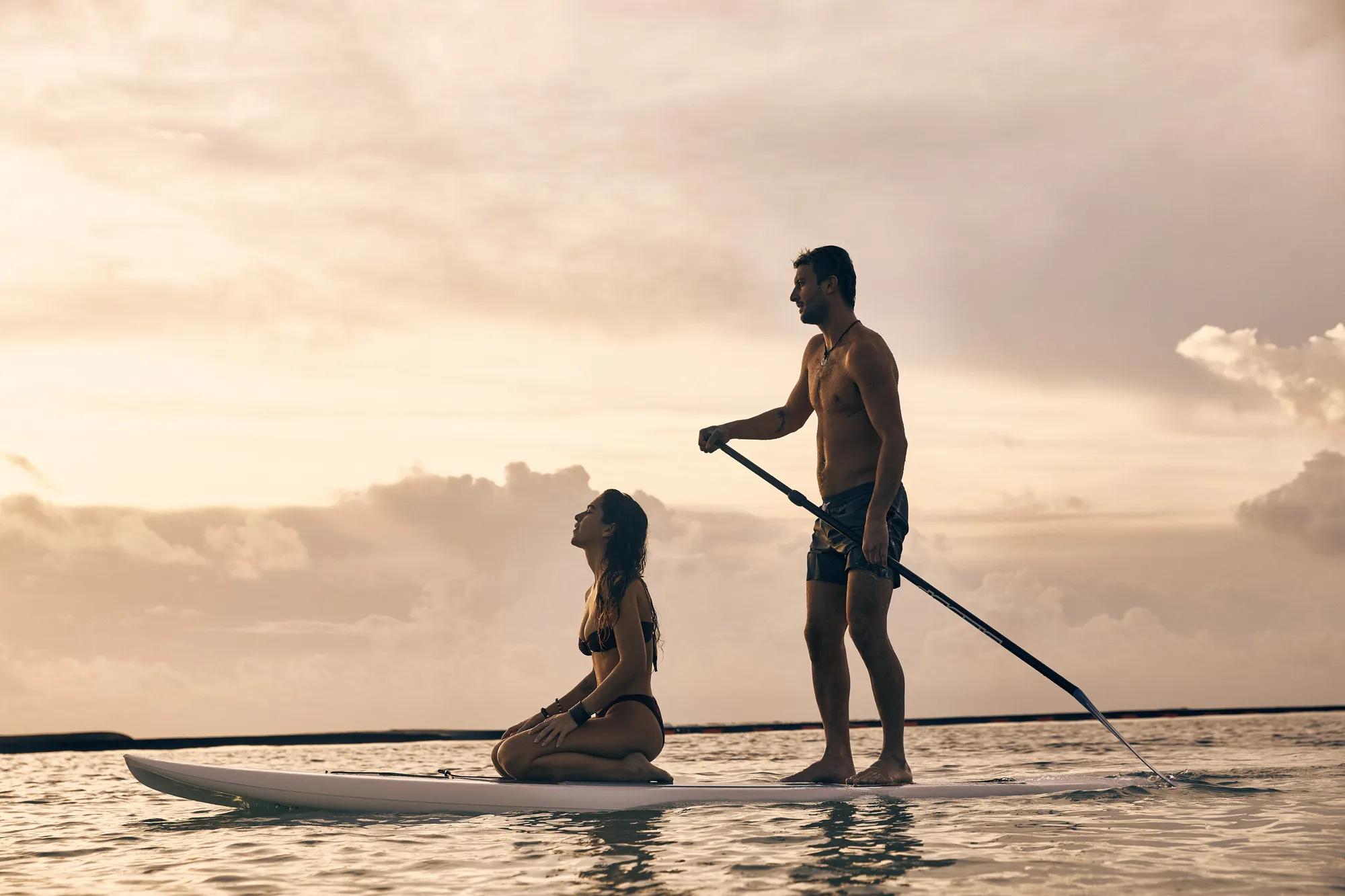 couple paddle boarding