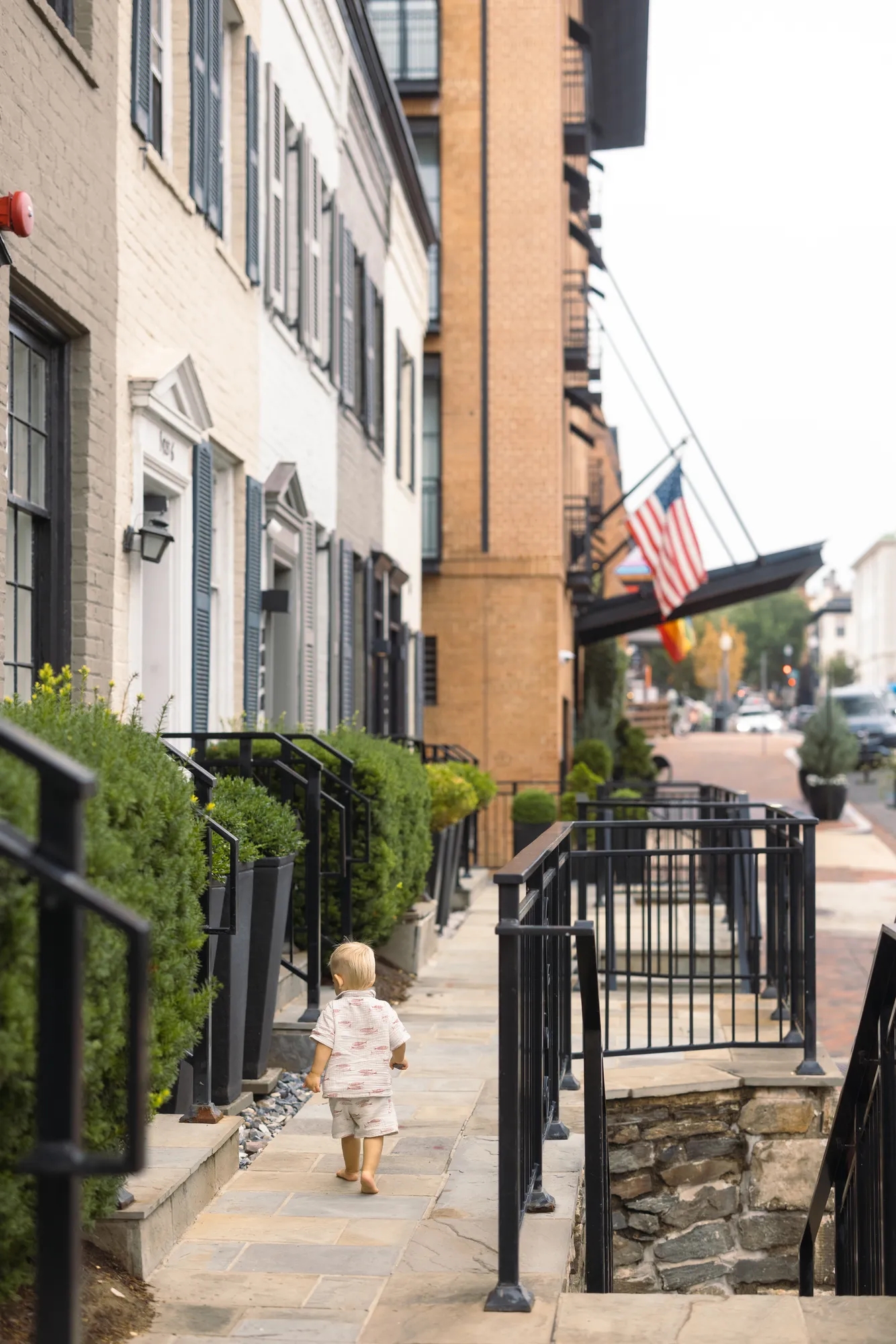 A child walking outside of the townhouses in Georgetown