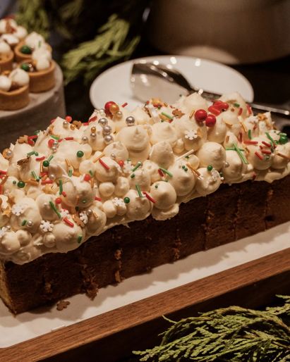 Dessert display during Santa Brunch at CUT D.C. featuring buche de noel