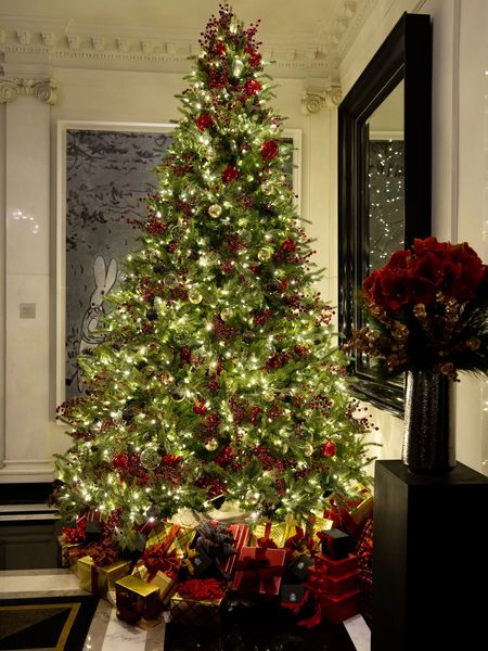 Christmas tree in the lobby of the Carlyle with presents underneath