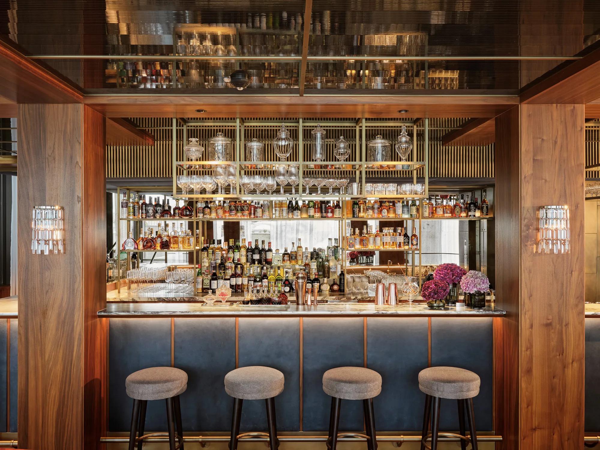 Salon Aurélie at Rosewood Vienna, an elegant lounge with hand-painted botanical murals, velvet seating, and natural light creating a refined, tranquil atmosphere.