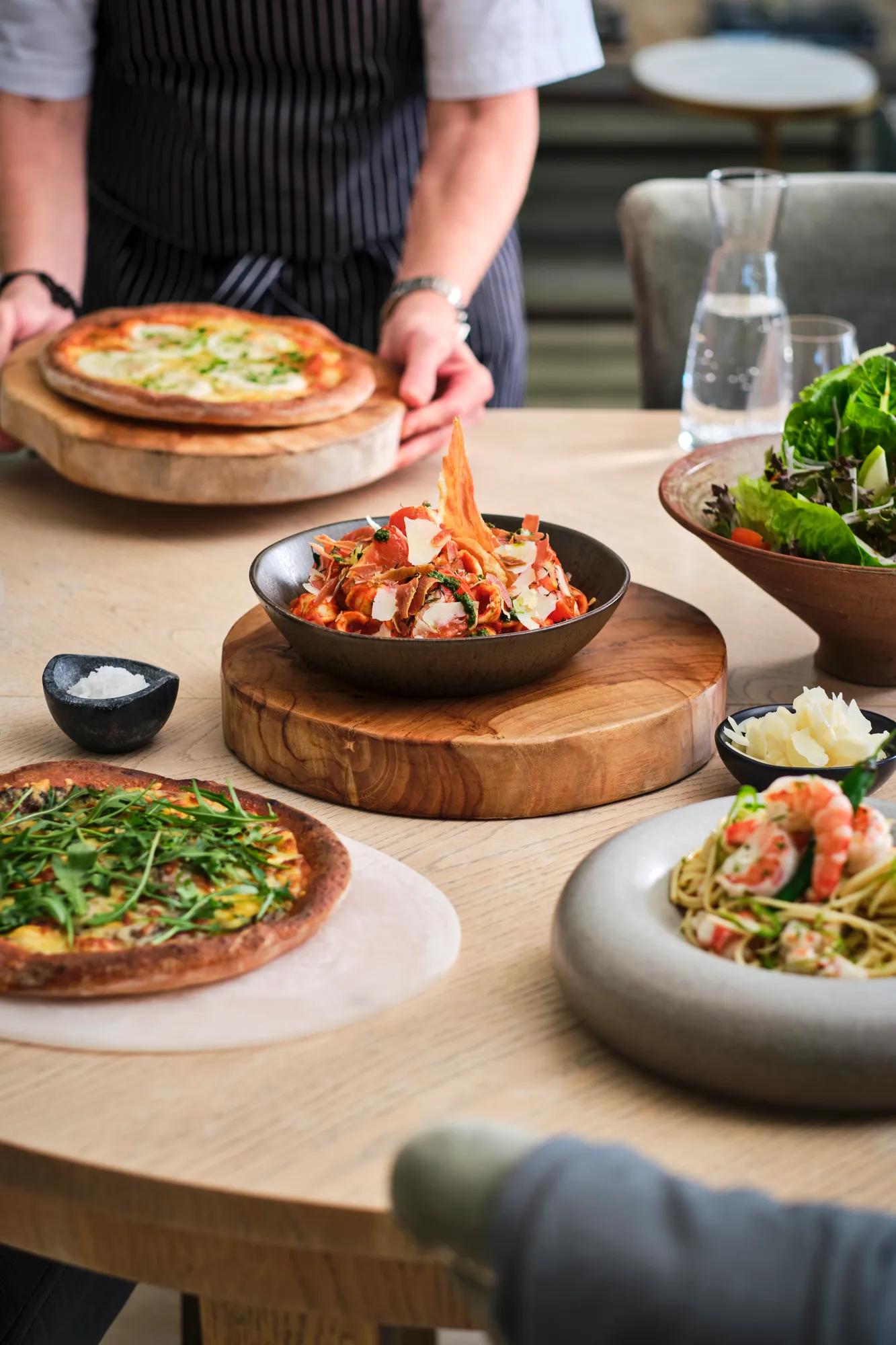 Table set with a variety of Italian dishes in a private villa