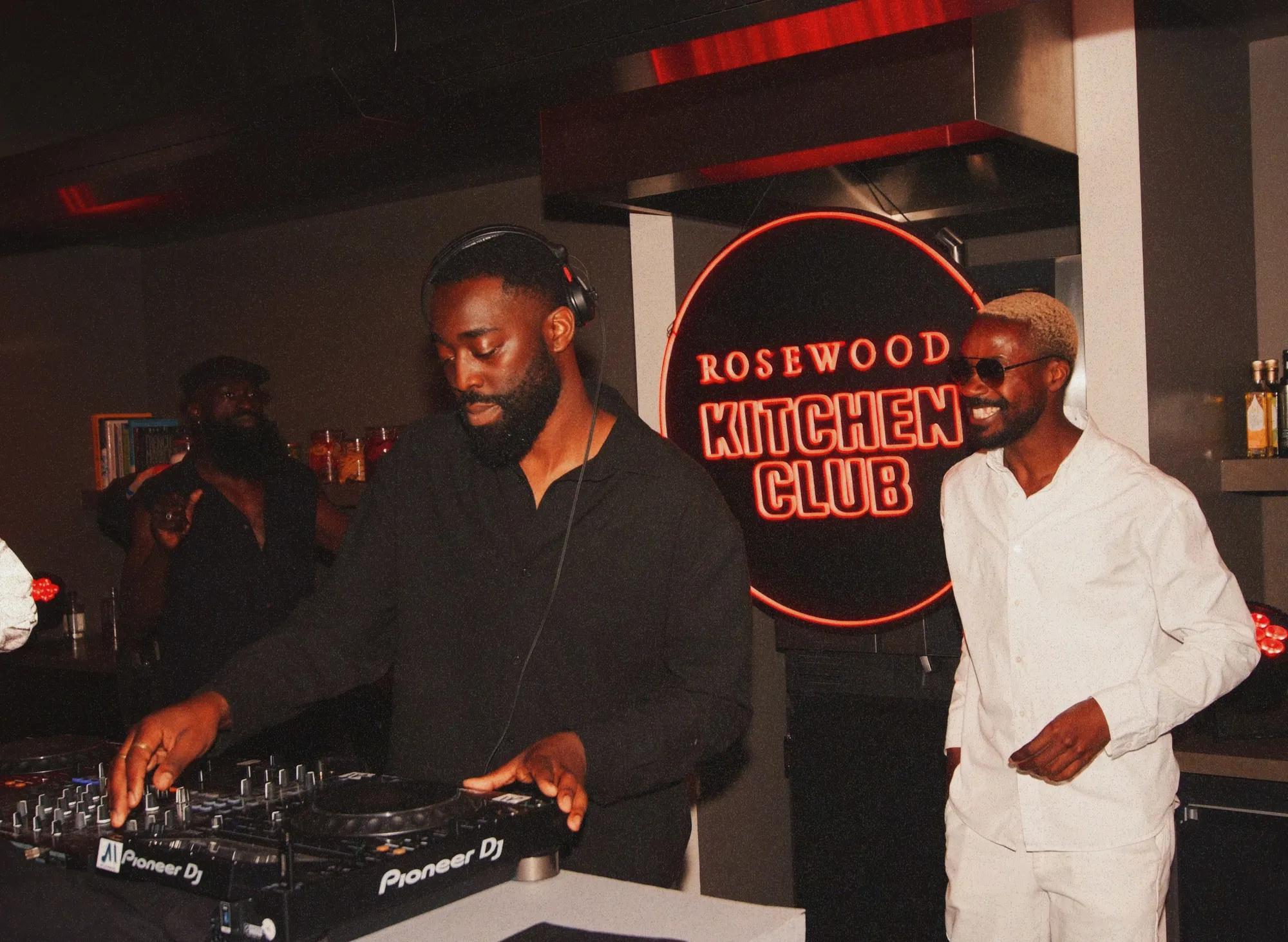 2 men behing a DJ booth