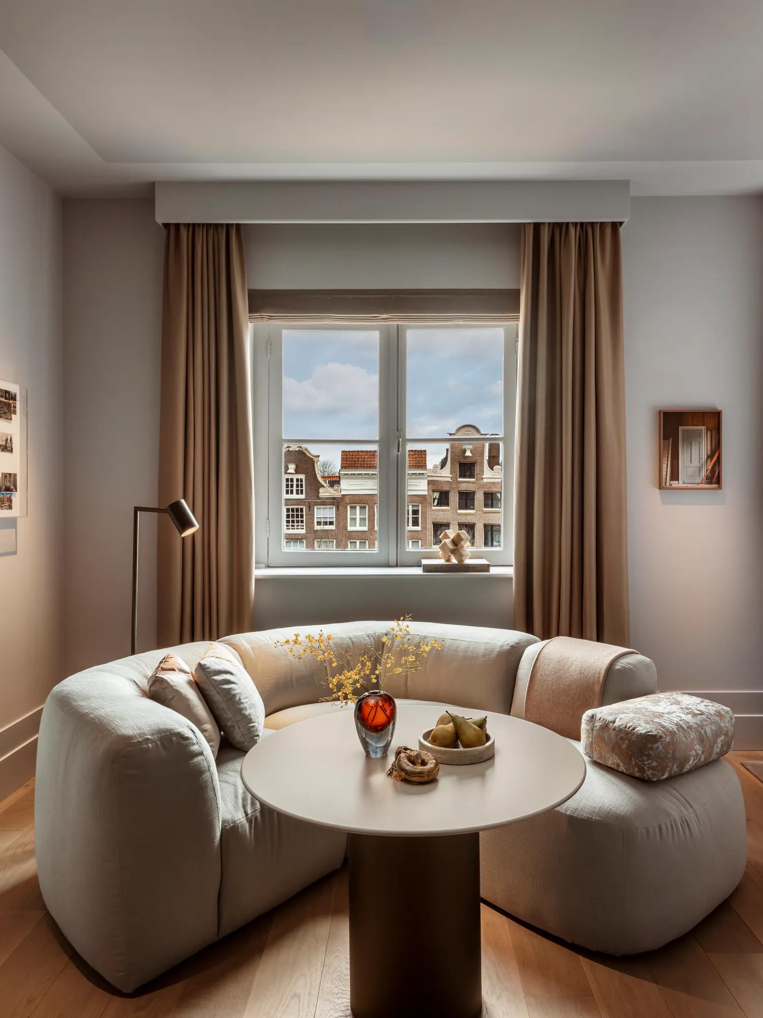 Luxurious hotel bedroom with elegant decor, plush bedding, and ambient lighting.