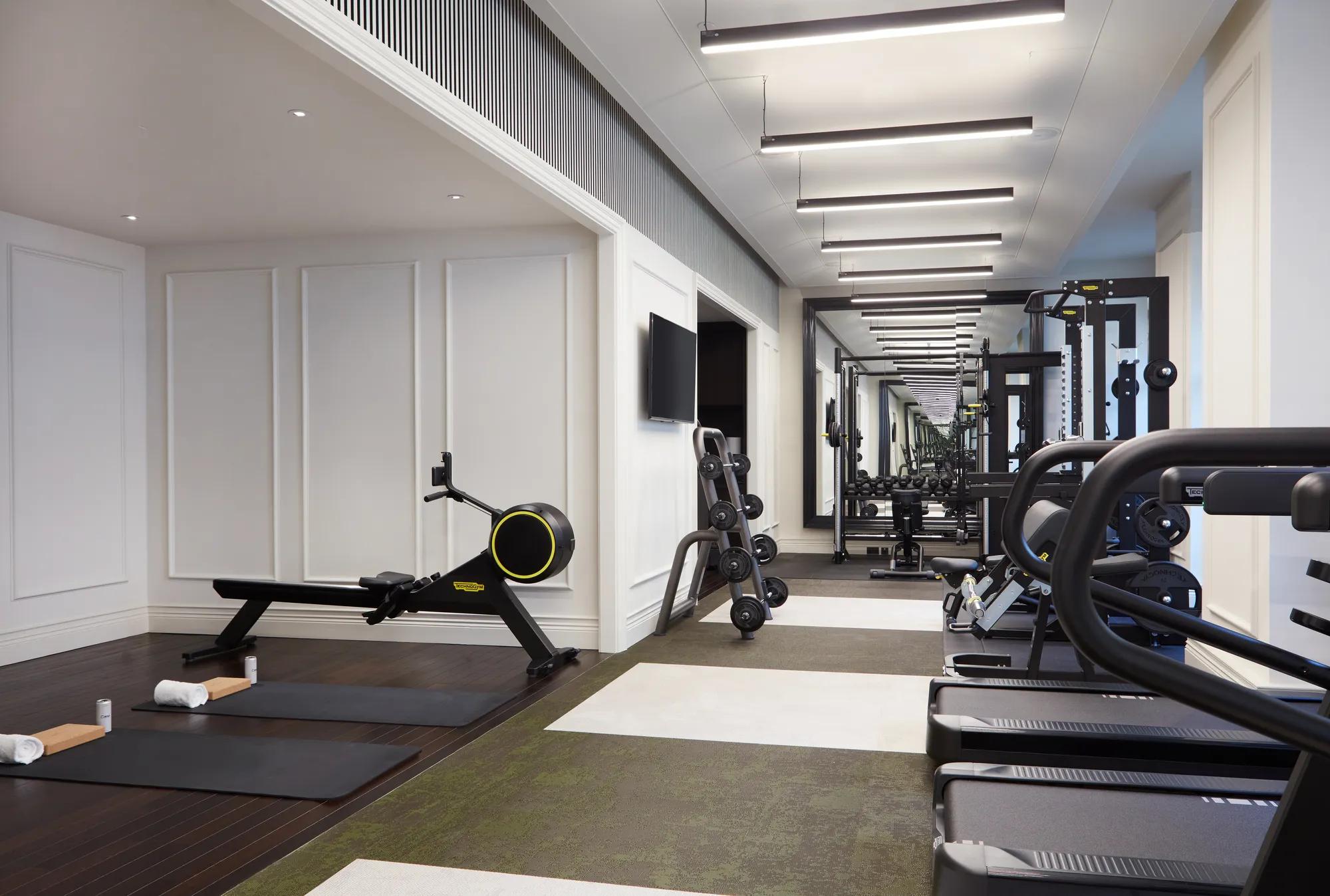 Fitness suite at Rosewood London featuring Technogym equipment, free weights and dedicated training space