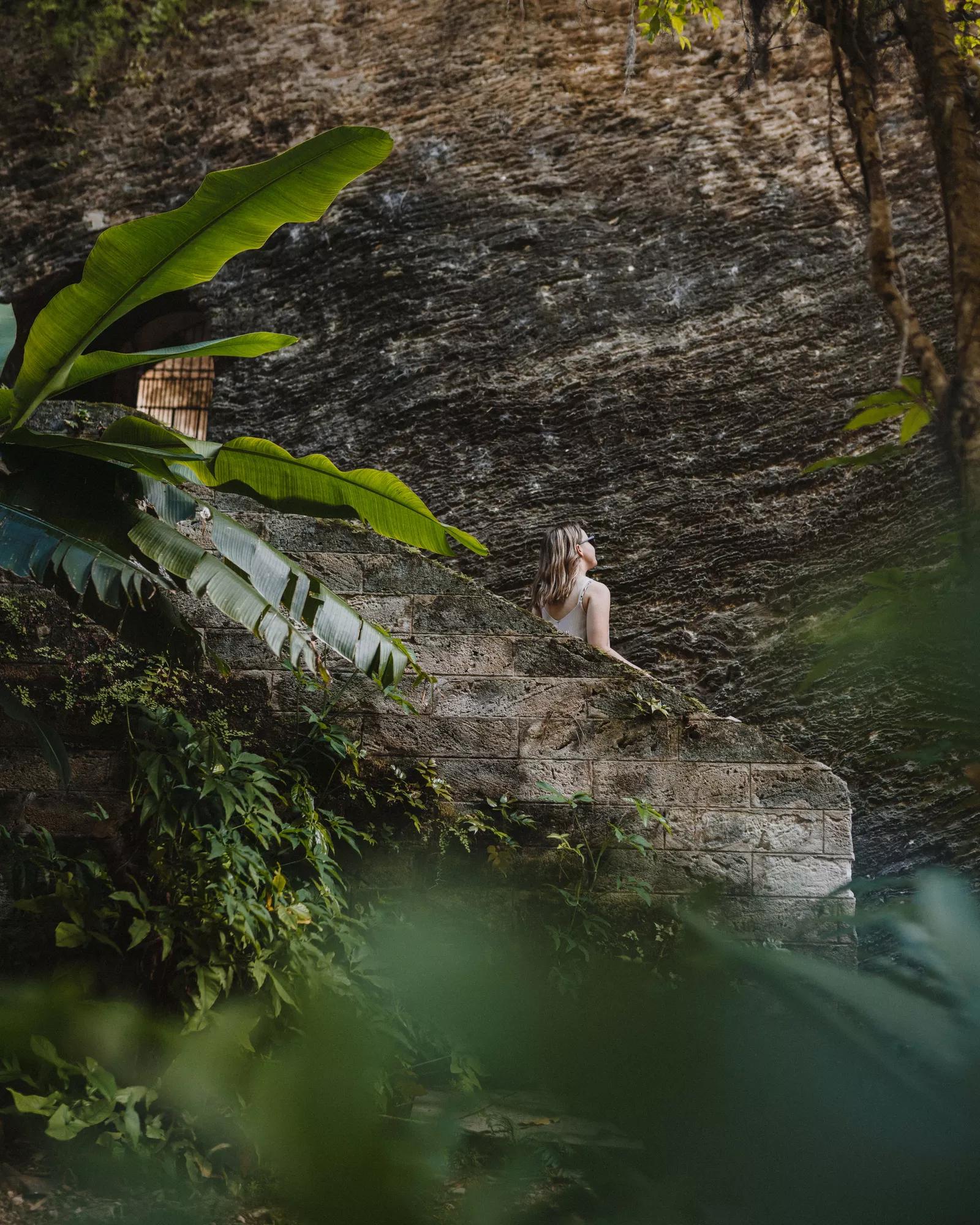A woman standing on the stairs at Fort Hamilton