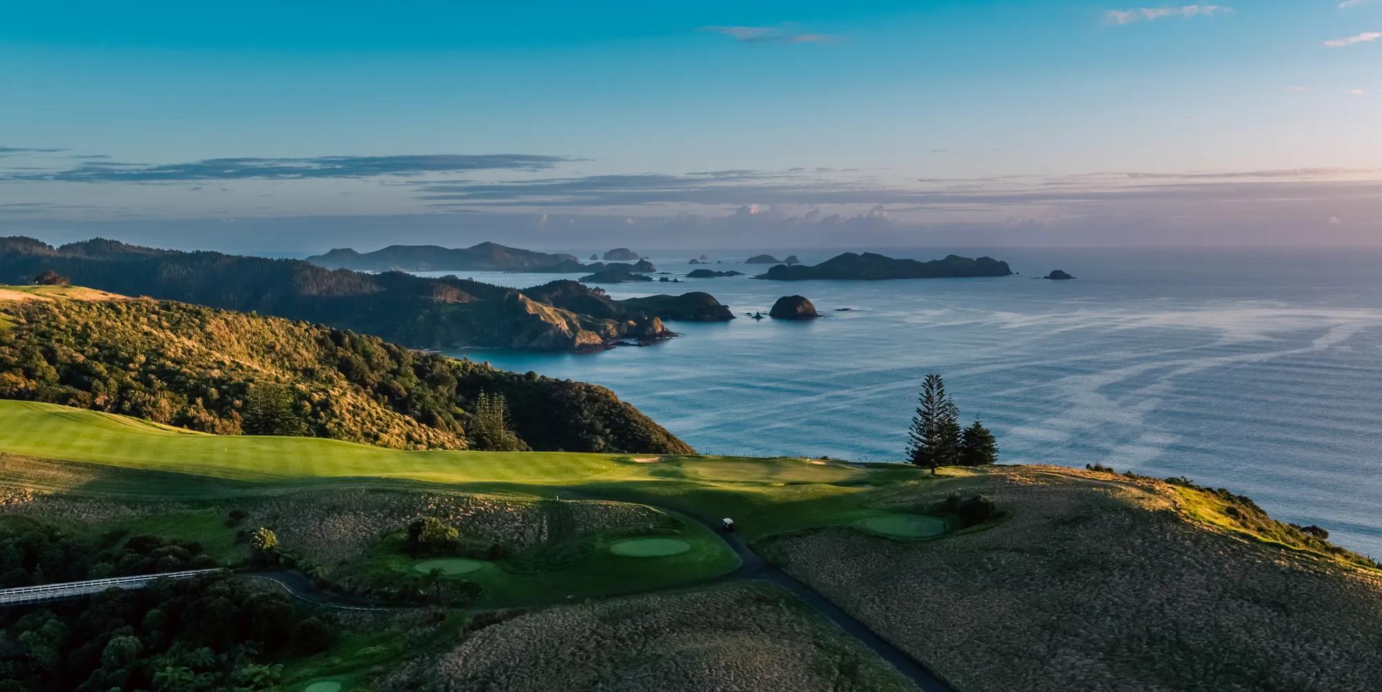 Aerial view of Kauri Cliffs golf course fairway with ocean and Cavalli Islands in the background