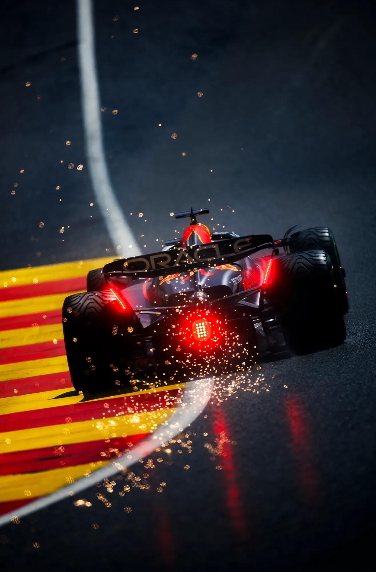 F1 car on circuit with red back lights