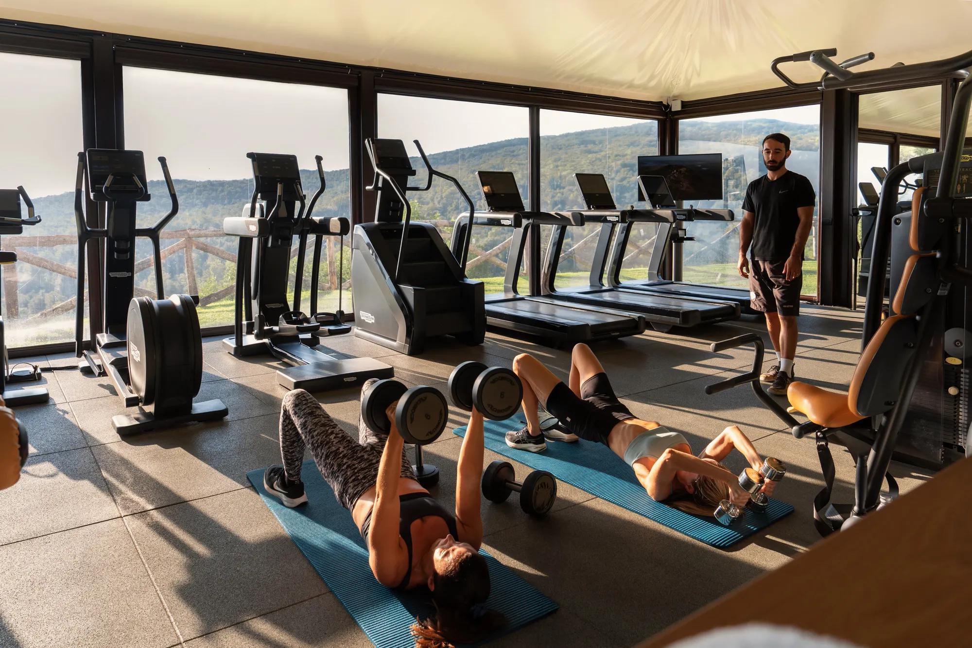Fitness center 24/7 with Tecnogym training machines at Rosewood Castiglion del Bosco.