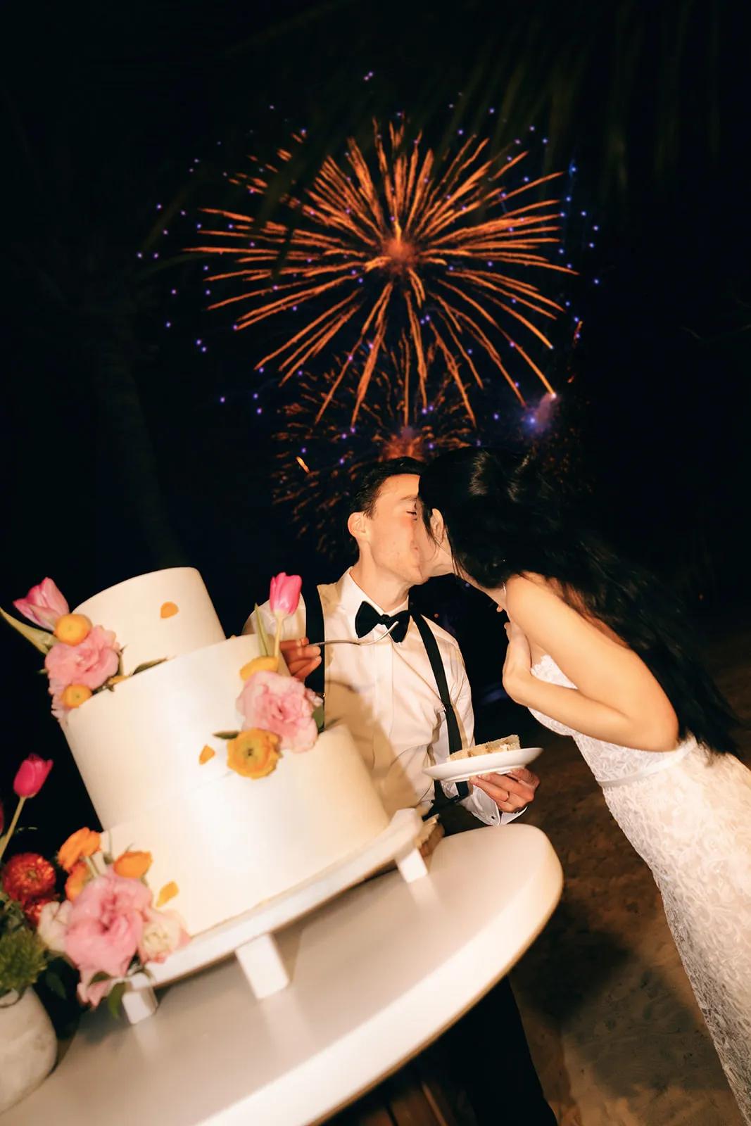 Couple cutting cake