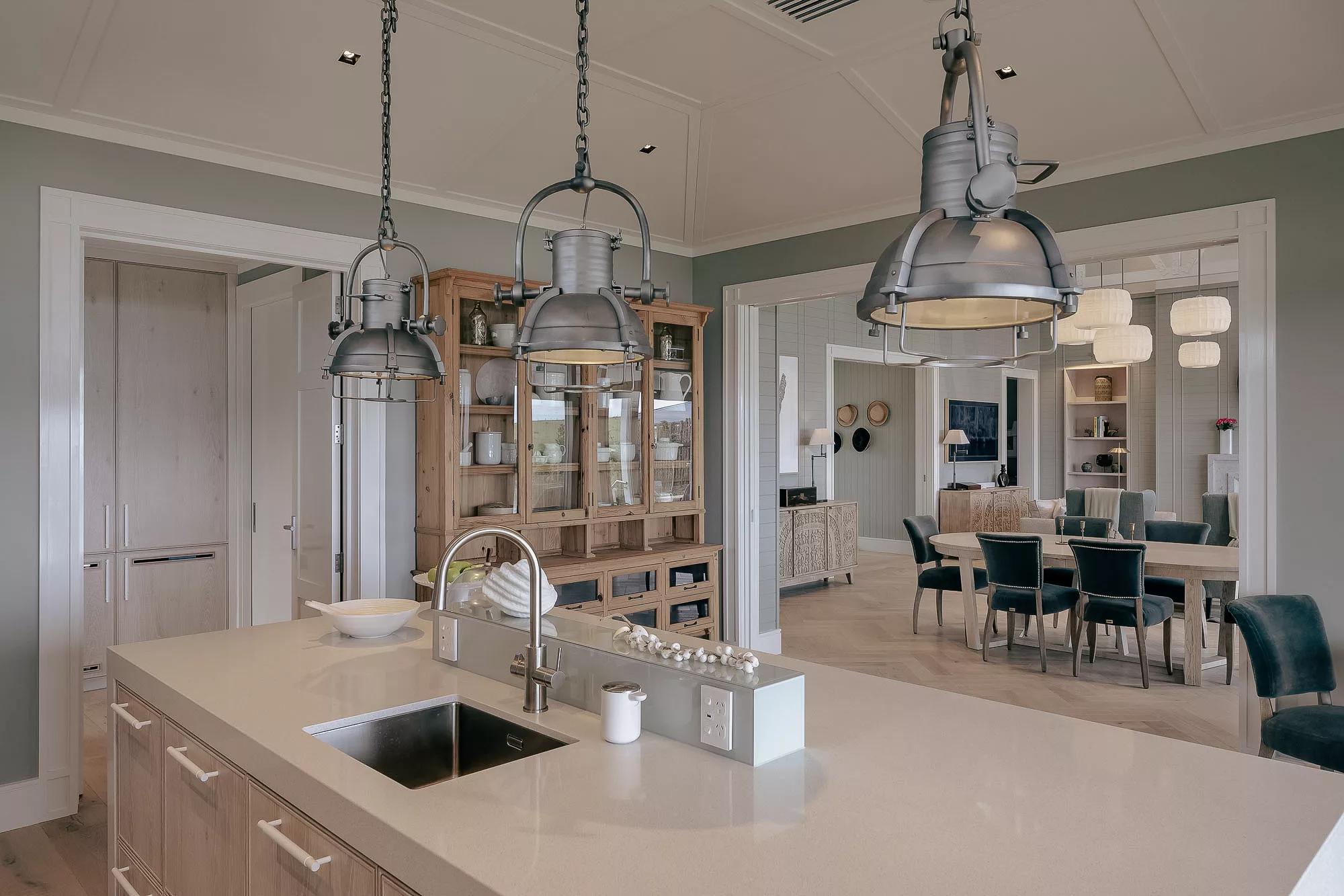 Spacious contemporary kitchen in the luxurious four bedroom villa at Rosewood Kauri Cliffs.